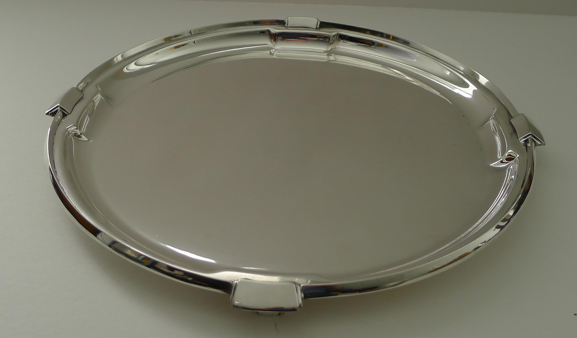 A stunning Art Deco cocktail tray by the top notch silversmith, Walker & Hall of Sheffield.

Standing on four very stylish legs, the tray is solid and heavy ready to adorn the finest of bars. Fully marked on the underside, 