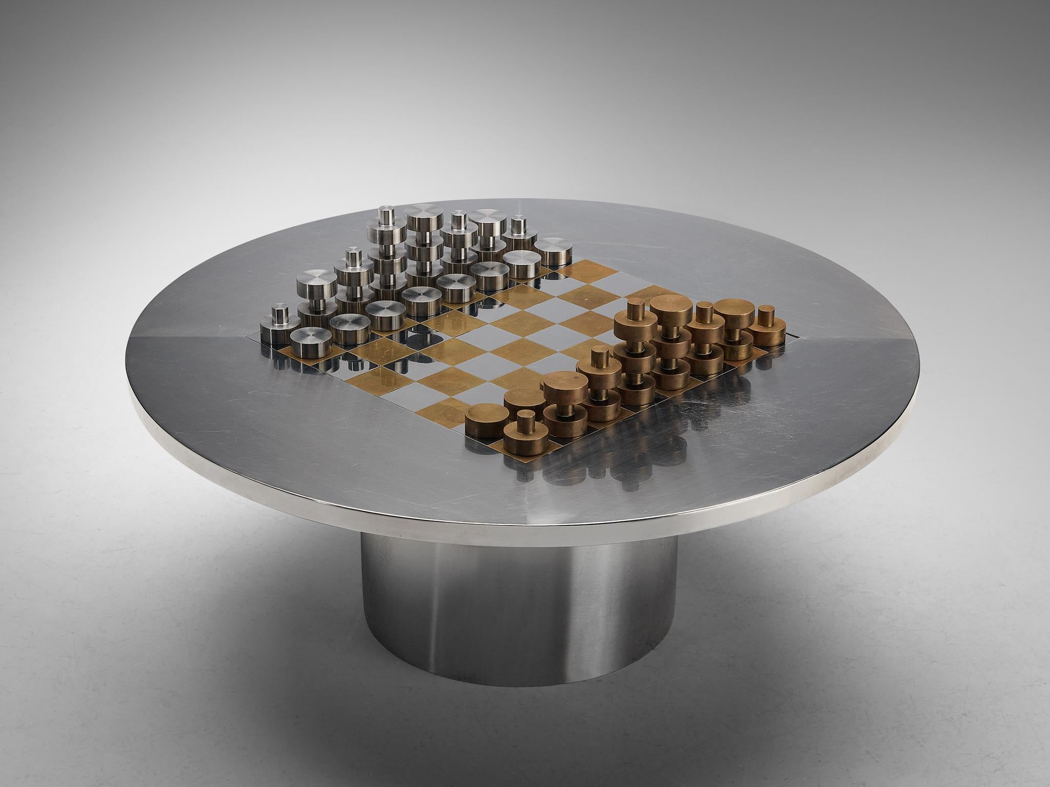 Chess table, brass and chrome-plated steel, circa 1975.

A very sleek and stylish chess table with matching chess set. The brass and chrome-plated steel in which these items are executed together with the modern design give this set a very