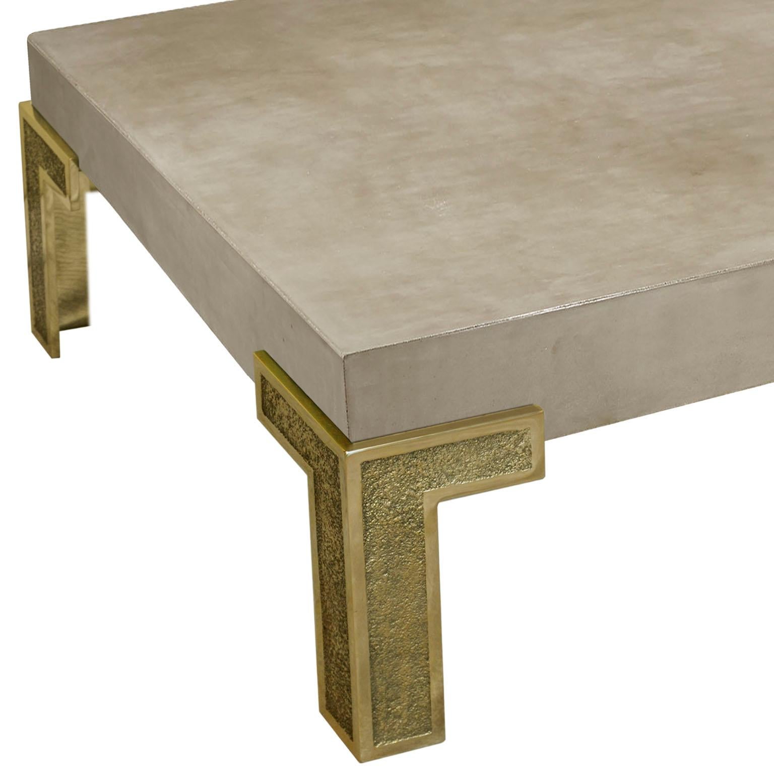 Smart F coffee table is a modern expression of the scagliola that takes you into an essential solution, where the perfect combination of two different materials like scagliola art in the color if concrete and brass lives creating a new harmony.  The