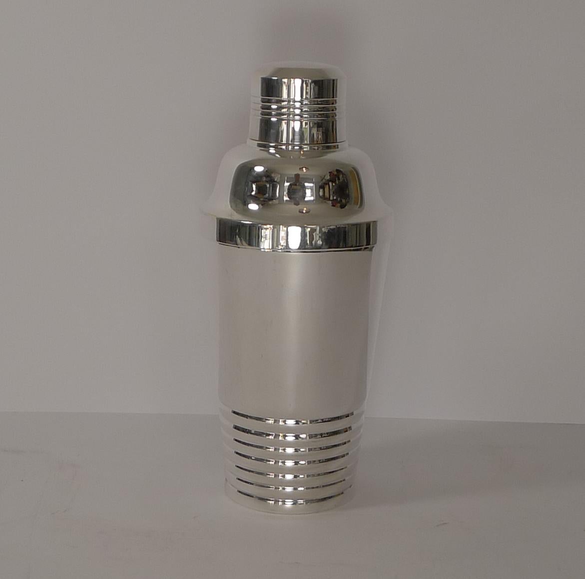 A superb French Art Deco Cocktail Shaker dating to the 1930's and in fabulous condition having just been professionally cleaned and polished in our silversmith's workshop.

The underside is marked as per the photographs.

Measures: 8