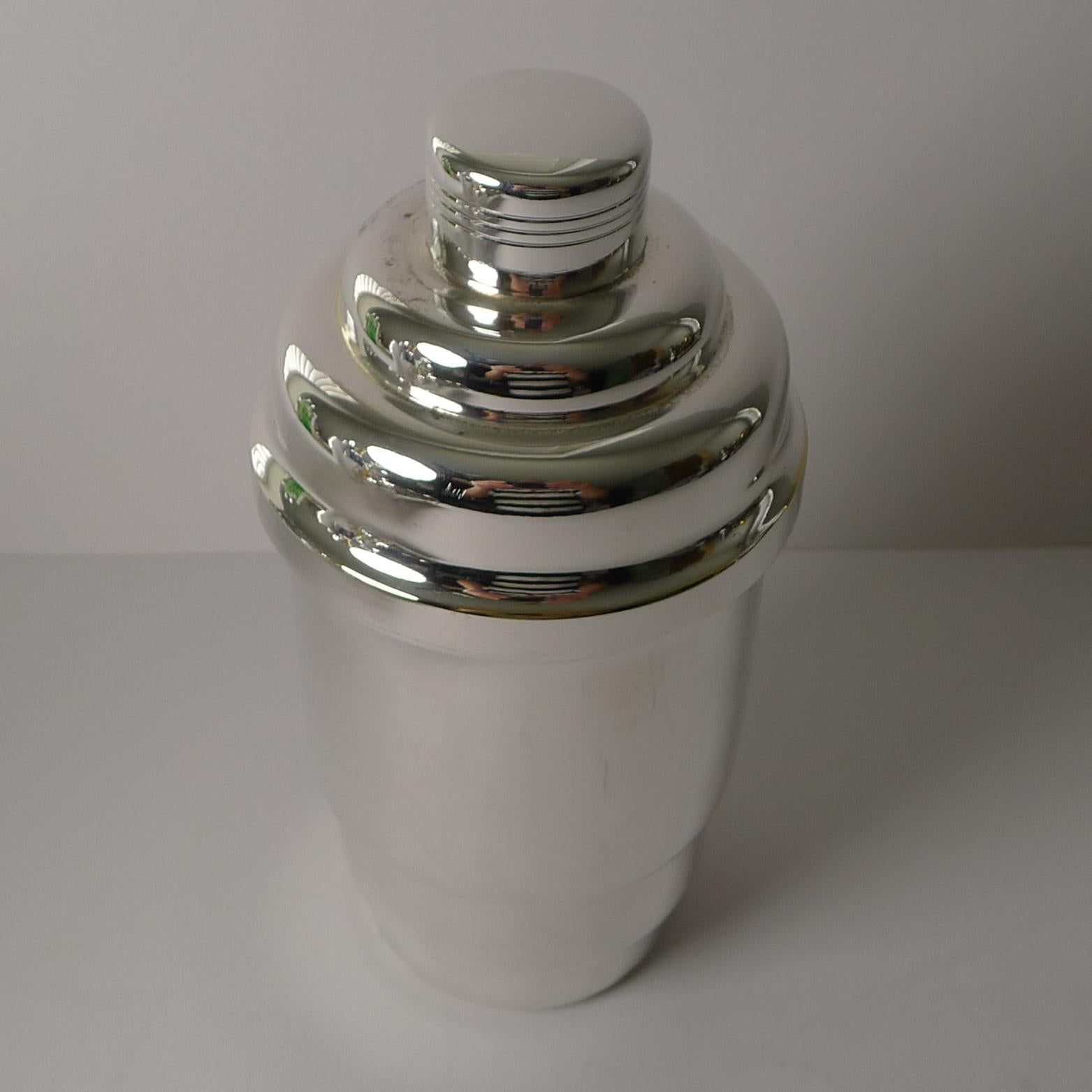 A fabulous looking silver plated cocktail shaker, a striking, bold shape to adorn the finest of bars.

French in origin and dating to the 1930's. Just back from our silversmith's workshop, it has been professionally cleaned and polished, restoring