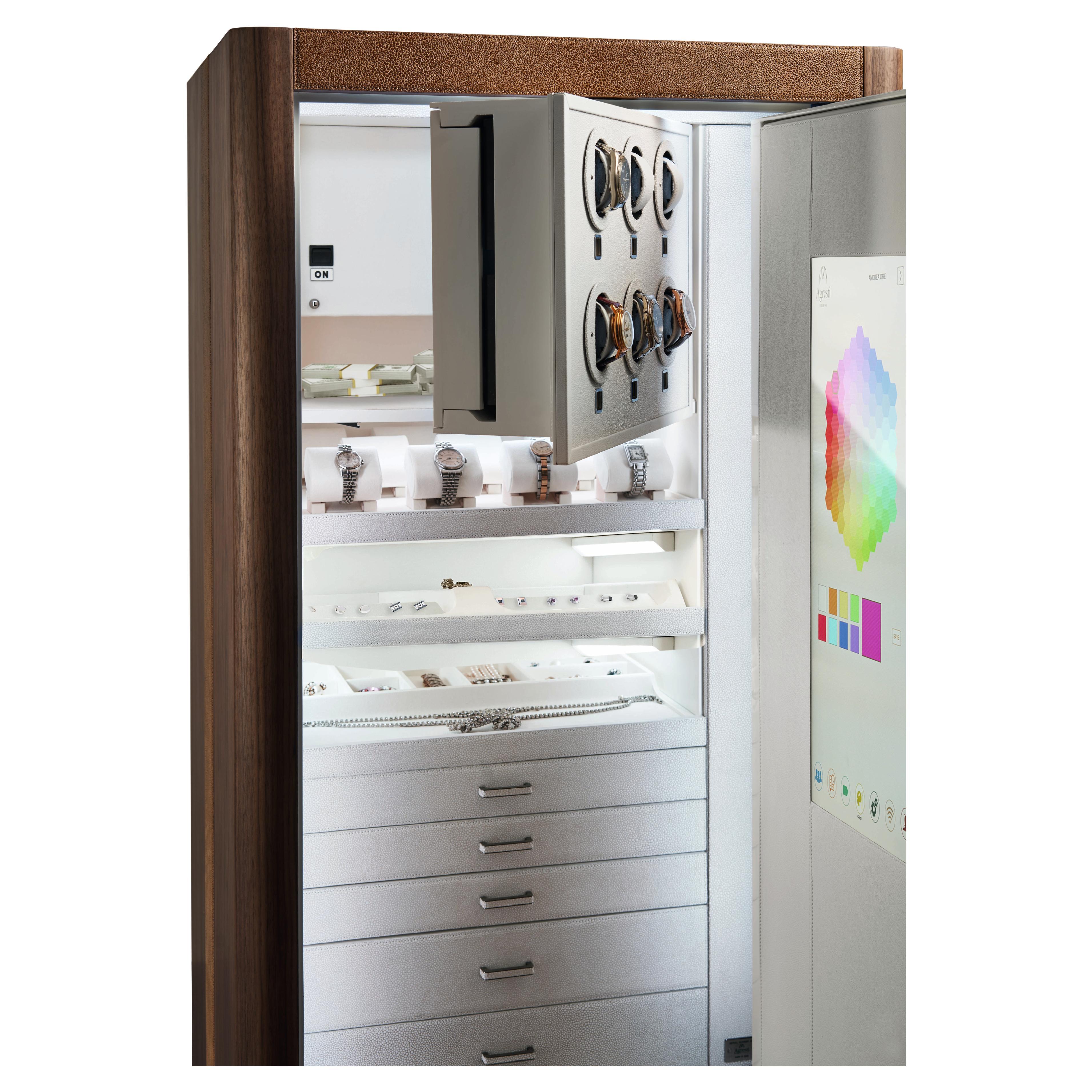 Interactive armored armoire in matte finish Canaletto walnut or polished Ebony, with emergency key. White leather interior with 6 Swiss made watch winders and secret compartment. Ruthenium accessories.

- Opening with biometric device and face