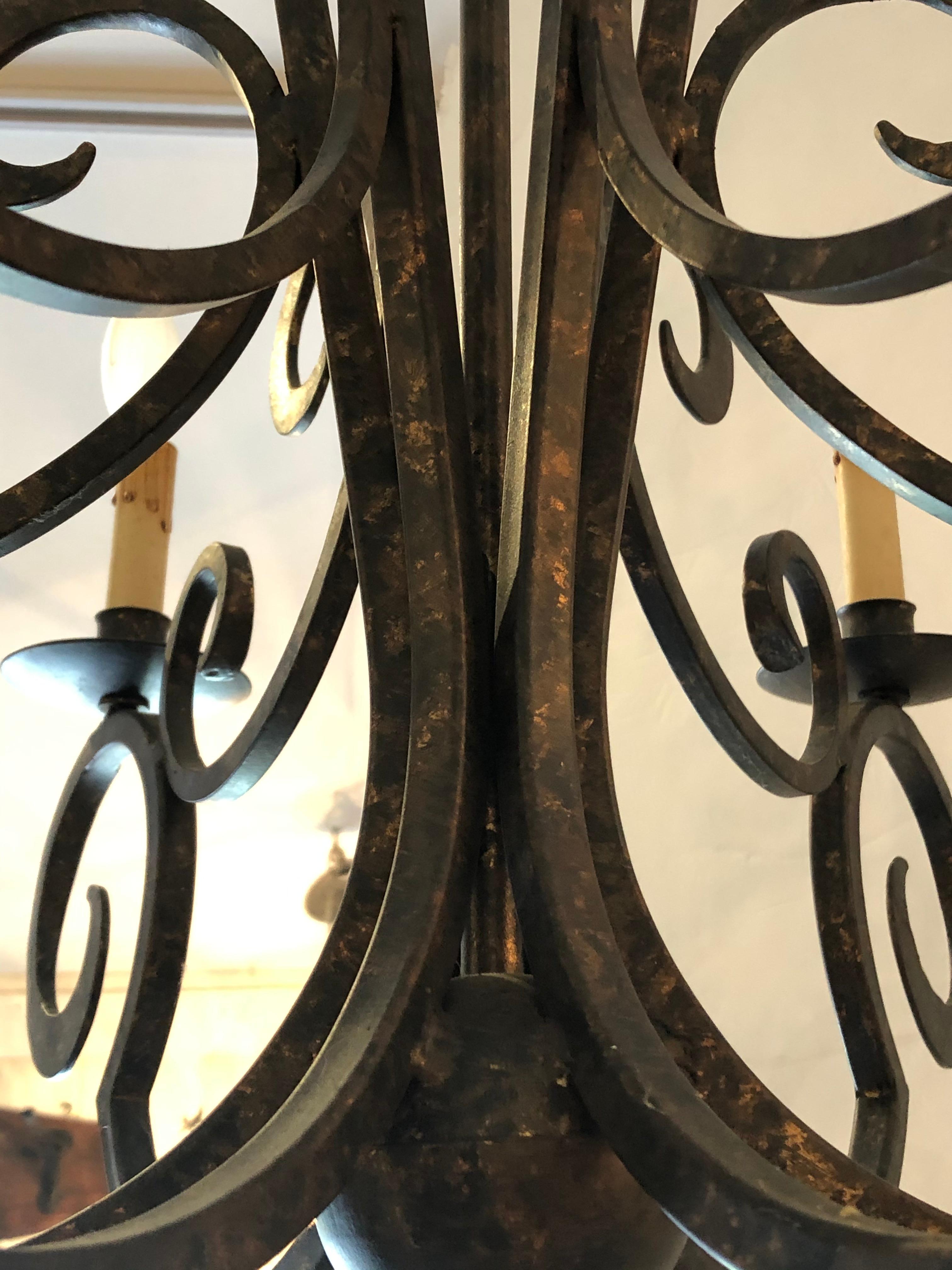 American Smashing Dark Brown and Gilded Wrought Iron Chandelier For Sale
