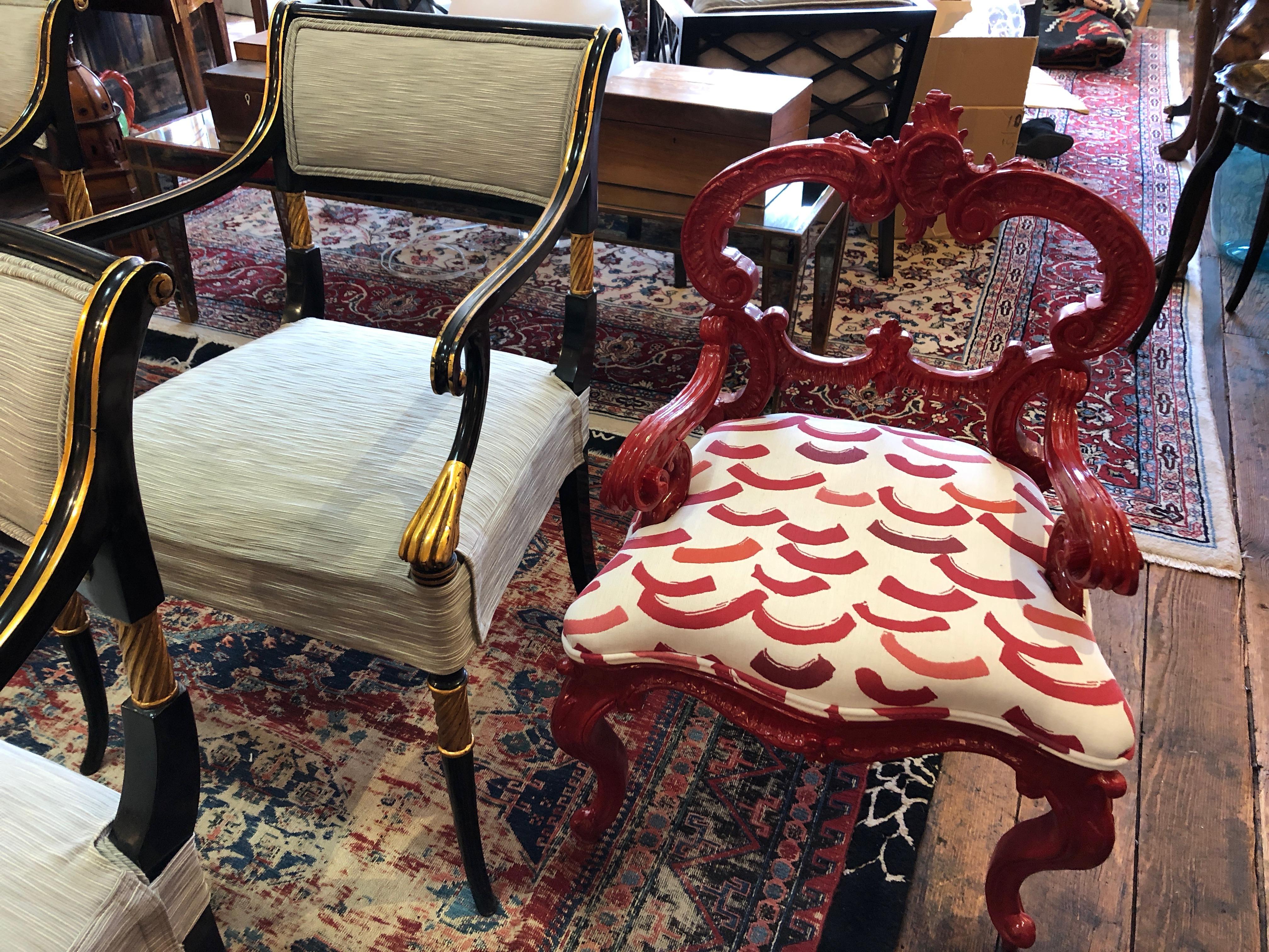High design in a small package is how we describe this super chic designer small chair having a cherry red shiny laquer Rococo frame and new contemporary graphic upholstery on the seat. Measures: Seat height 16, seat depth 16.5.