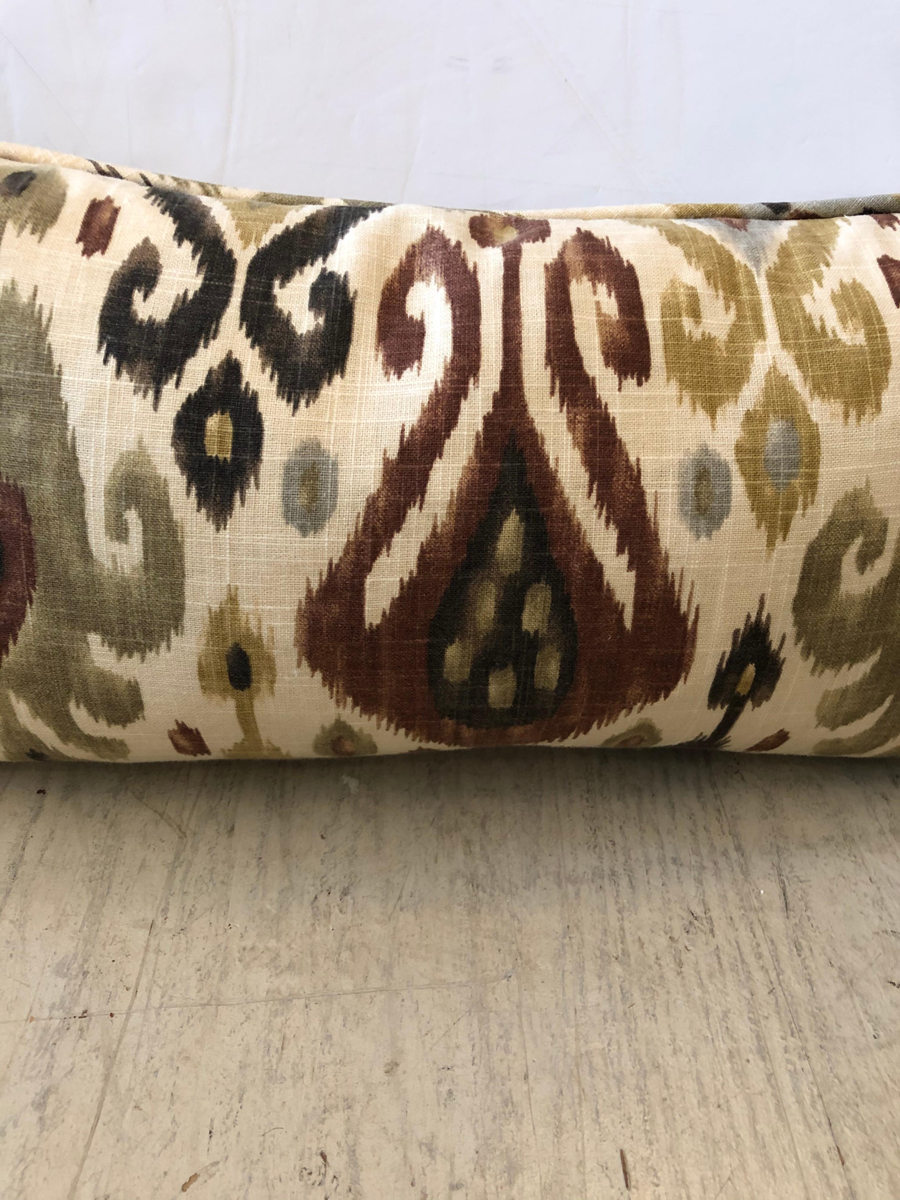 Great looking pair of Ikat pillows, down filled with zippers, in brown, cream grey and ochre.