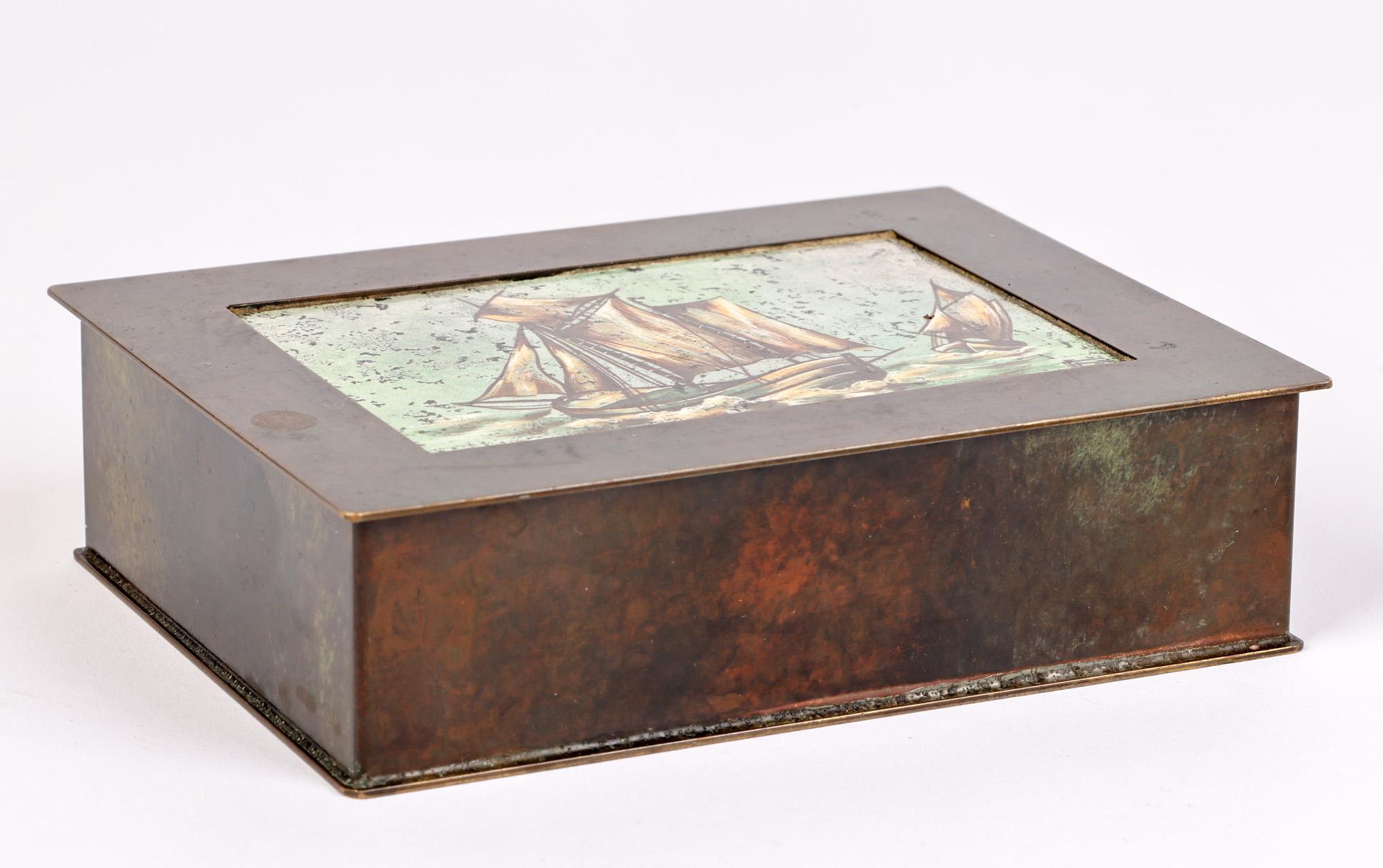 An unusual and stylish Danish Bronze box mounted with an enamel plaque with sailing boats marked Smedien and dating from around 1930. The rectangular shaped quality box is heavily made, the lower compartment lined with wood. With overlapping base