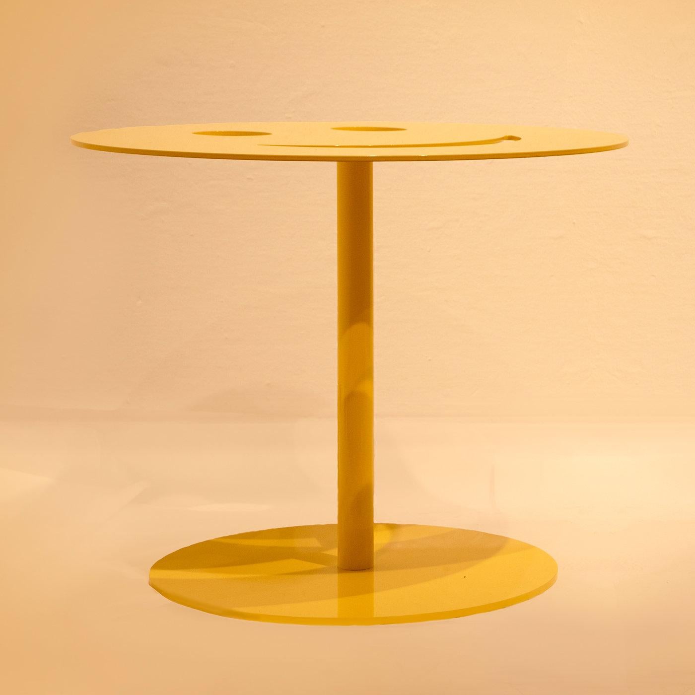 Giulia Maria Ligresti has taken the fun of social media and turned the iconic smiley face symbol into an original and fun statement piece. Handmade of iron with a vibrant yellow finish, this quirky coffee table will give the same happy feeling to