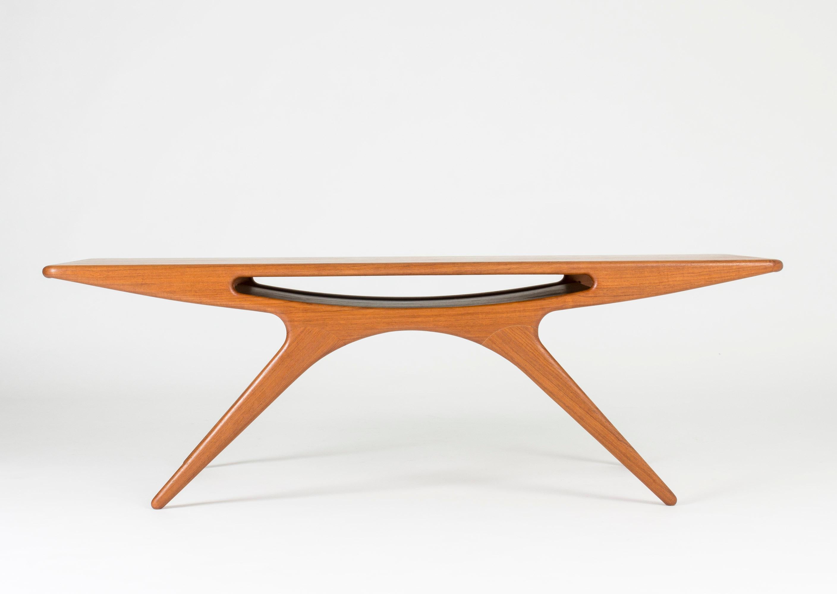 Teak “Smile” coffee table by Johannes Andersen, in a beautiful design with smooth lines and seamless joinery.