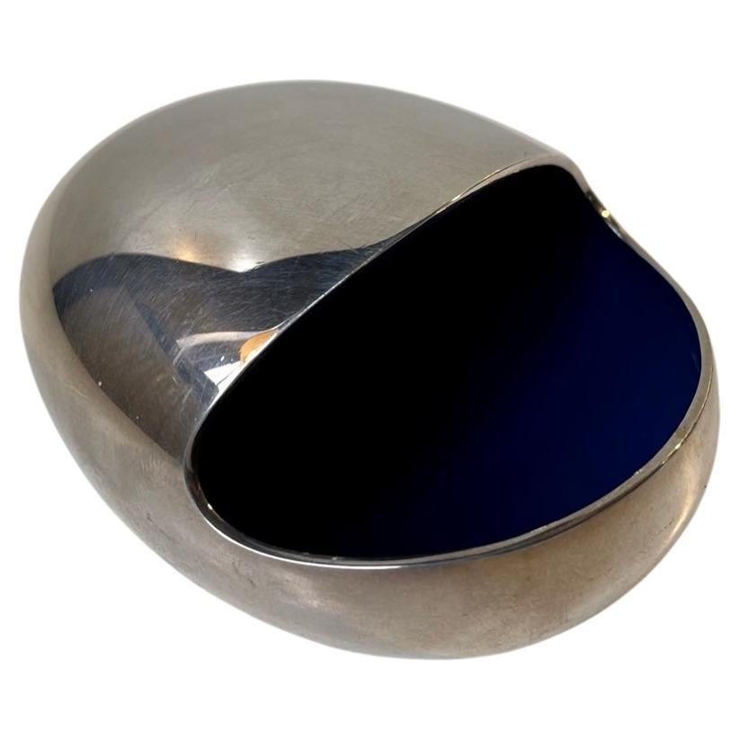 Egg shaped silver plated Ashtray/decorative dish or peanut dispenser with blue interior enamel. It is called the smile and was designed by Hans Bunde and manufactured by Carl Cohr in Fredericia Denmark during the 1950s. Stamped Cohr, Denmark - to