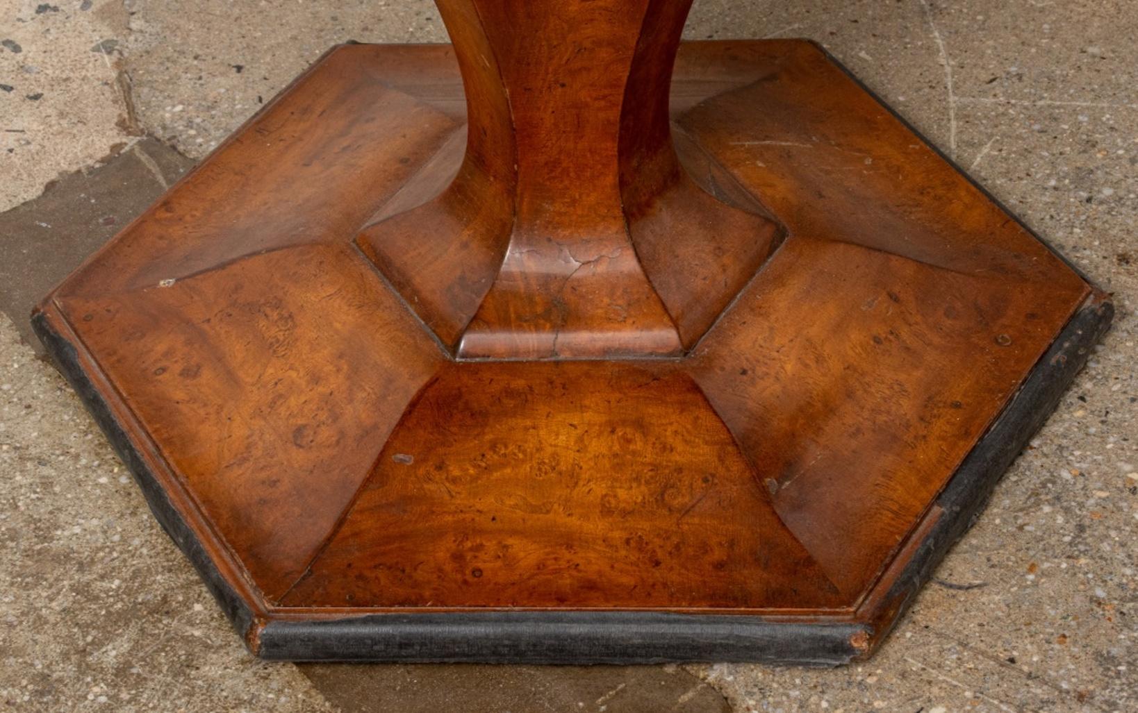 Smith and Watson round table with burlwood veneer and upon hexagonal base with maker's plaque to underside.

Dimensions: 26