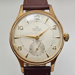 Smiths De Luxe Herrenuhr aus 9 Karat Gold mit arabischen Ziffern und 15 Steinen, alle englischen Ziffern