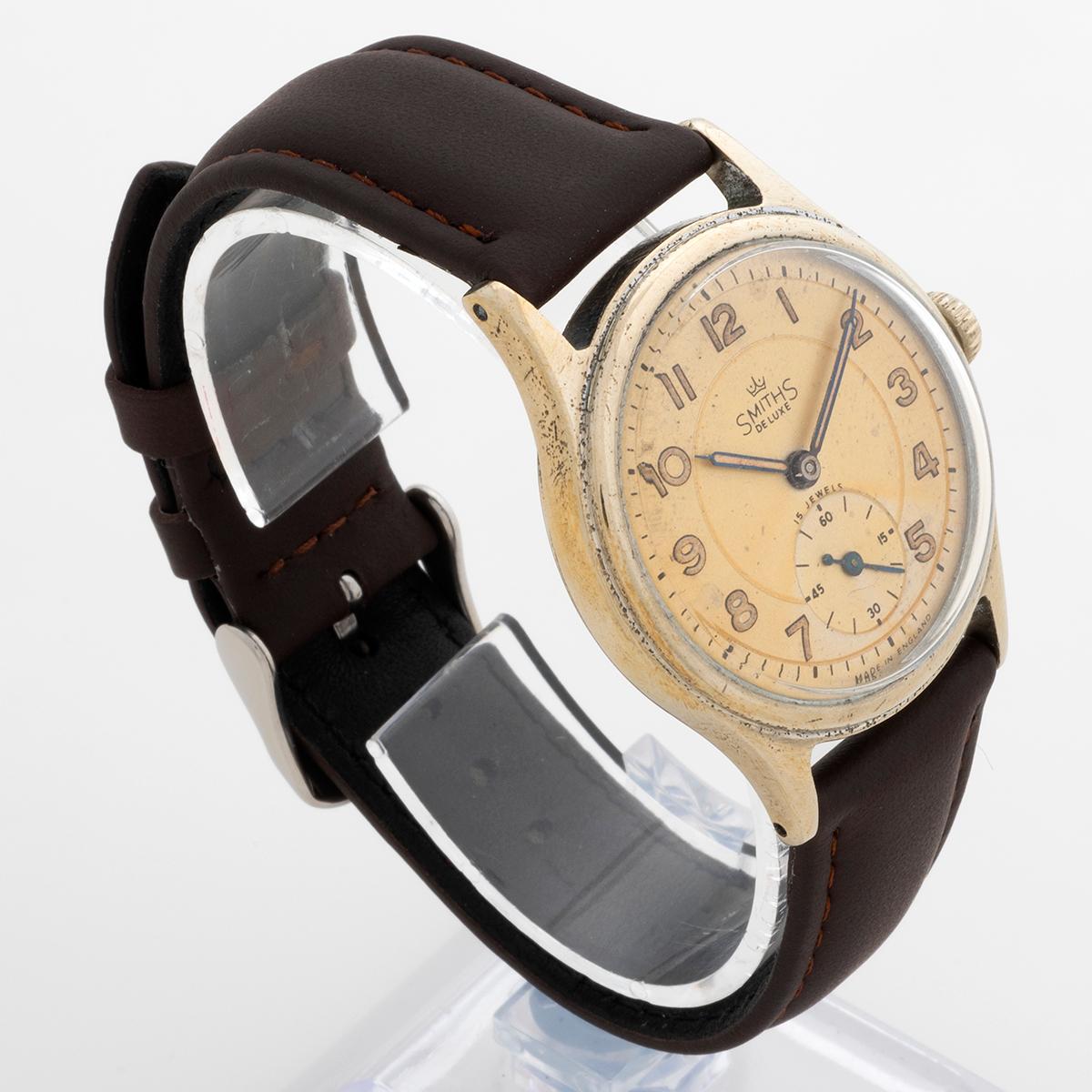 Our vintage and rare Smiths Deluxe A404 Aquatite, is one of the references as issued to the Everest expedition and declared by Sir Edmund Hillary as carried to the summit. The A404 is manually wound, features a sub seconds dial in a 33mm steel case