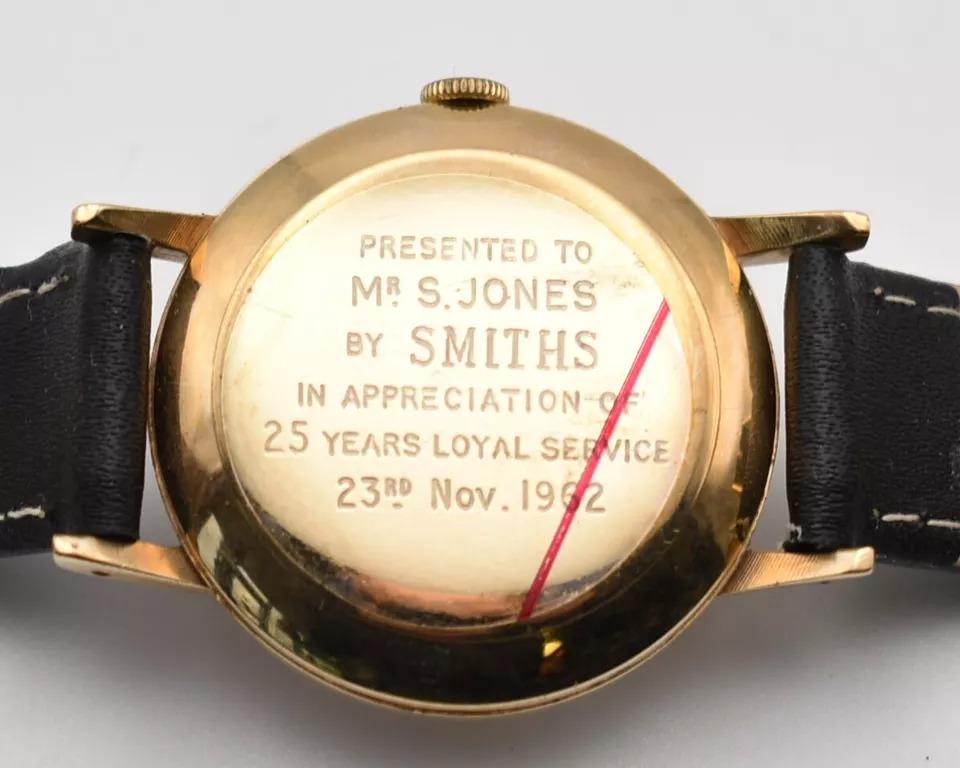 This vintage Smiths Imperial men's wristwatch from the 1960s is crafted in 9ct yellow gold and features a classic rectangular case with a polished finish. It houses a mechanical manual movement with 19 jewels and displays time on a striking two-tone