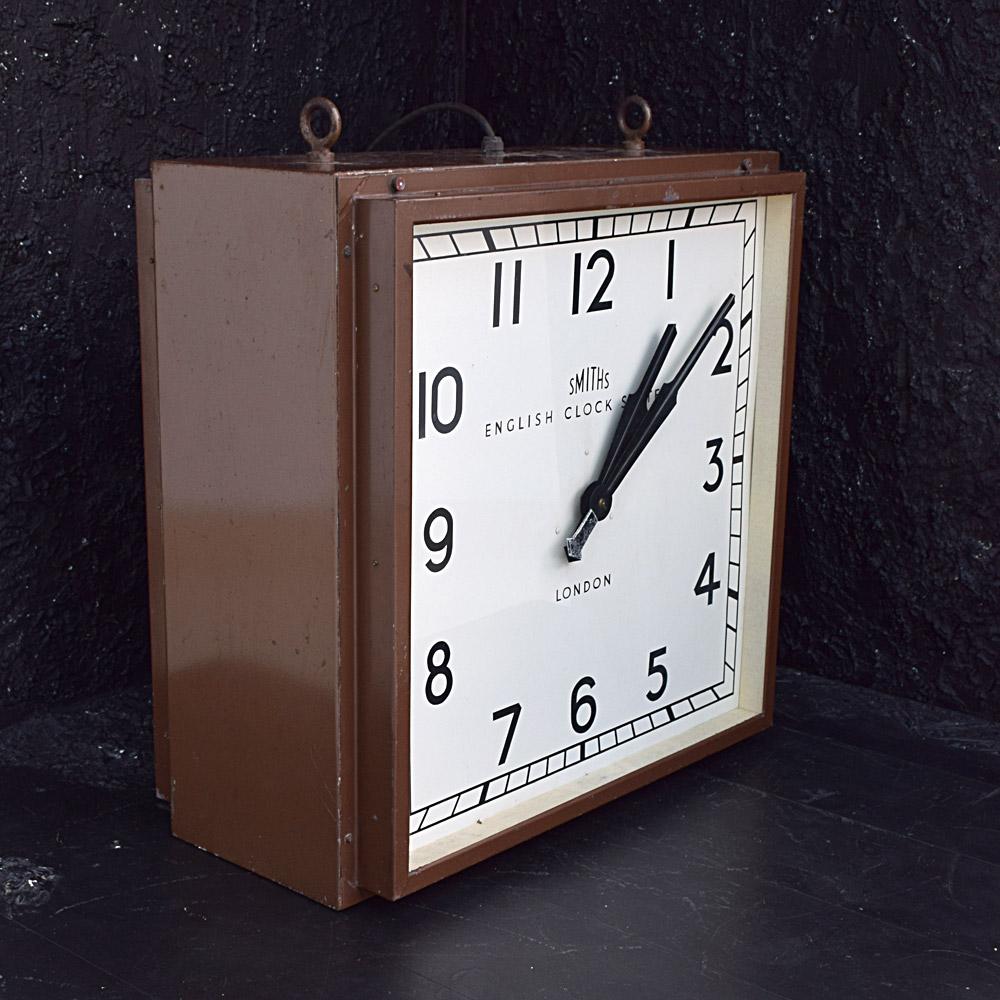Smiths of London double sided station clock
We are proud to offer an untouched original early 20th century Smiths of London double sided huge station clock. In its purest form paint color, cast metal hanging hooks, metal face, metal frame, double