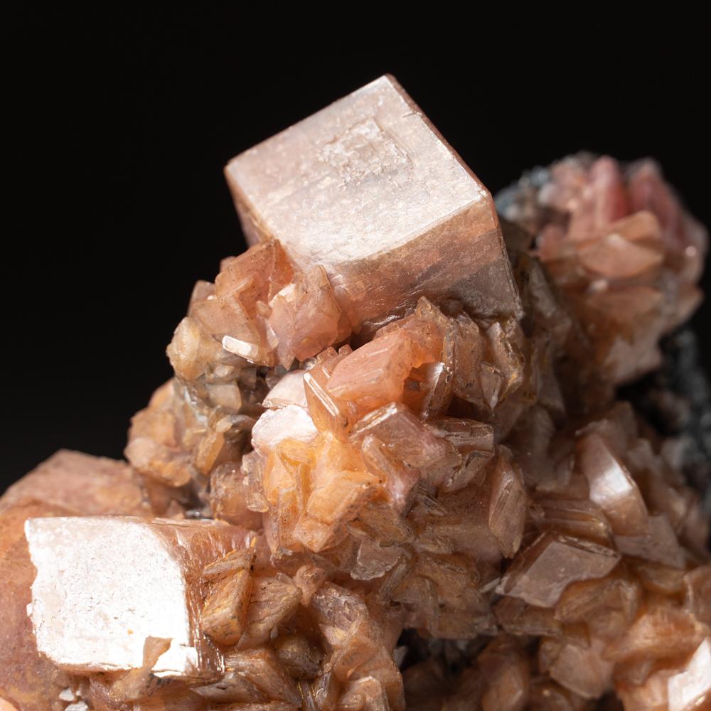 From Tsumeb Mine, Otavi-Bergland District, Oshikoto, Namibia Lustrous beautiful complex rhombic crystal cluster of pink smithsonite on matrix. Crystals have sharp terminations with glassy luster faces. Classic old collection specimen. Its unique