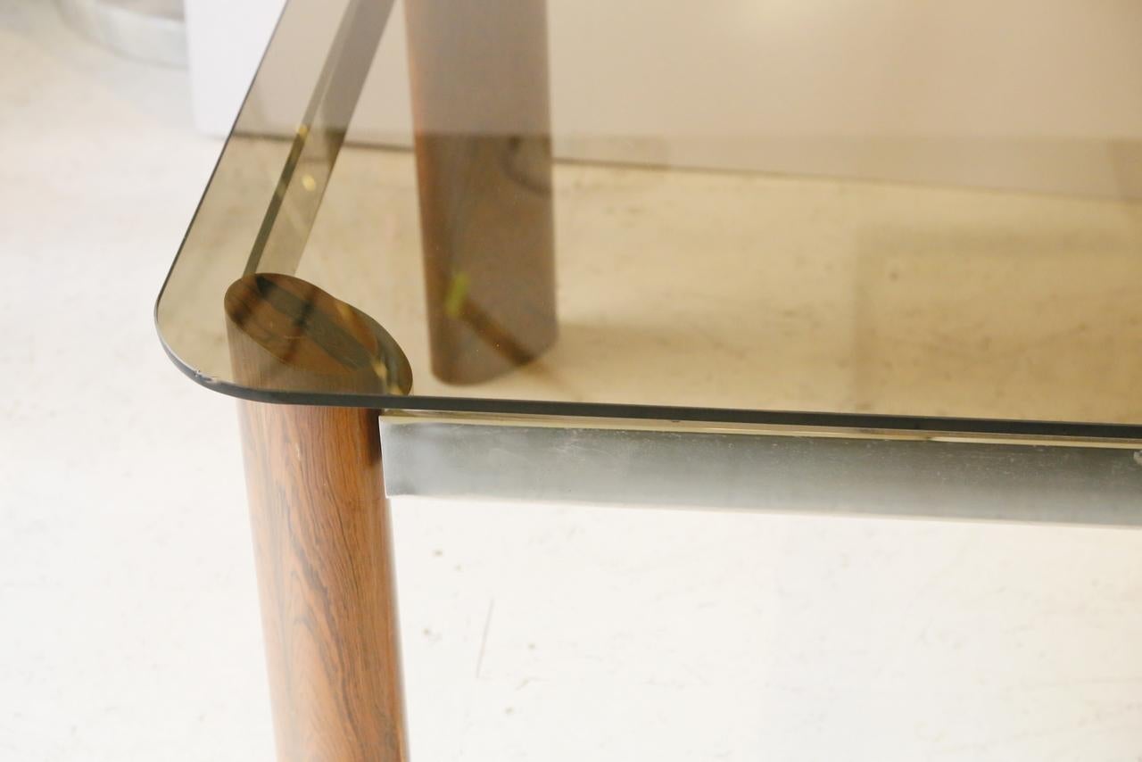 Smoke glass and veneer wood chrome-plated steel coffee table in mid-century modern style from the 1970s.