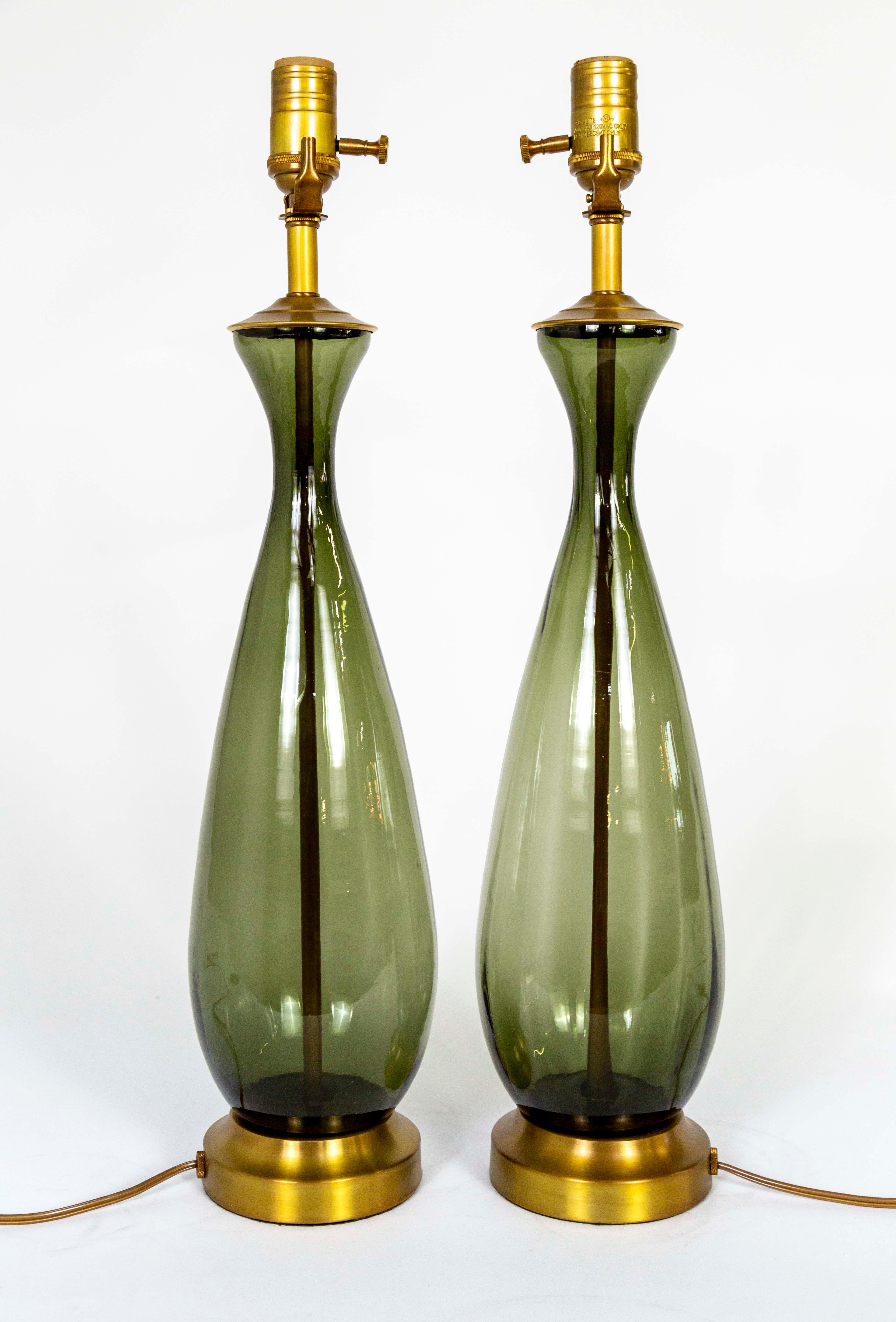 A pair of vintage, Murano glass table lamps in a unique, transparent, smoke gray-green color and elegant drop shape with subtle ribs. Refashioned with new brass bases, caps, stem, and sockets. Newly wired with dimmers on the sockets. Circa 1950. 5