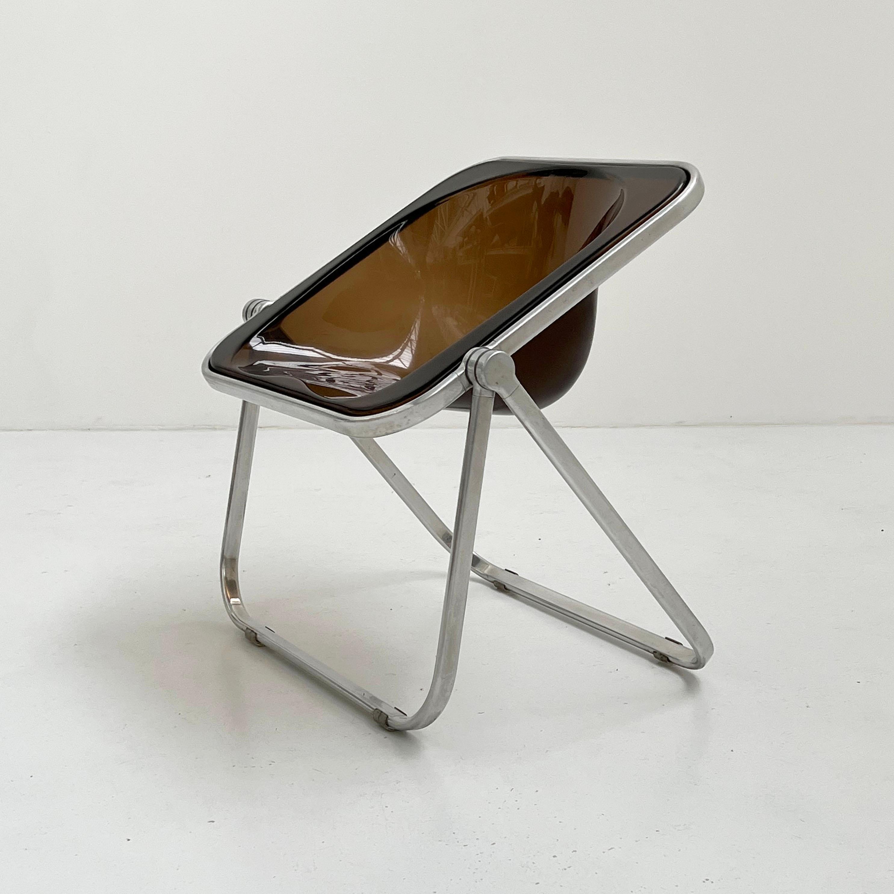 Designer - Giancarlo Piretti
Producer - Anonima Castelli
Model - Plona Chair
Design Period - Seventies
Measurements - Width 68 cm x Depth 60 cm x Height 75 cm x Seat Height 46 cm
Materials - Aluminum, Plastic
Color - Smoke, Silver
Light wear