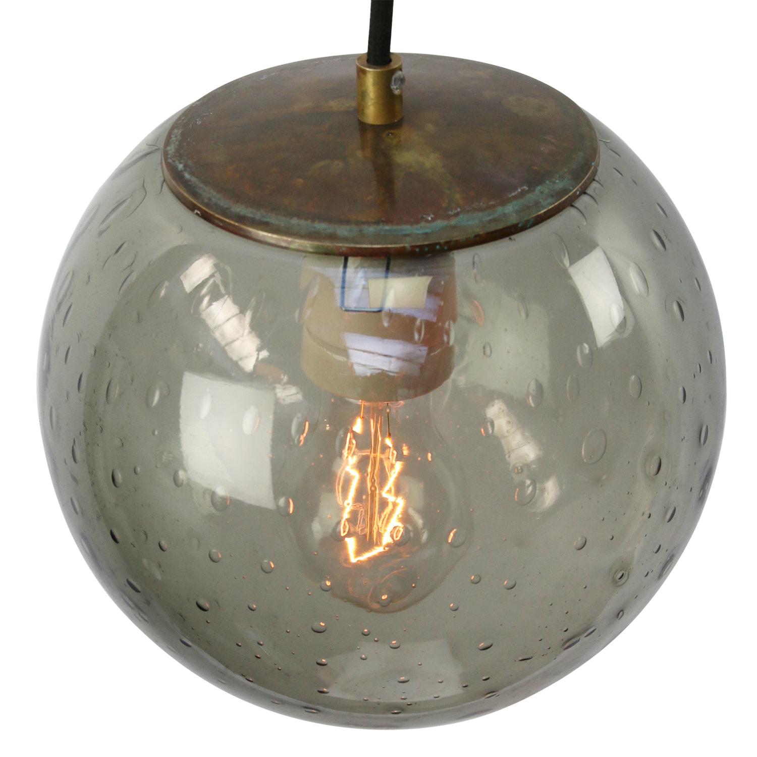 Original vintage smoked air bubble glass pendant.
2 meter black wire
Brass top

Weight: 2.00 kg / 4.4 lb

Priced per individual item. All lamps have been made suitable by international standards for incandescent light bulbs, energy-efficient