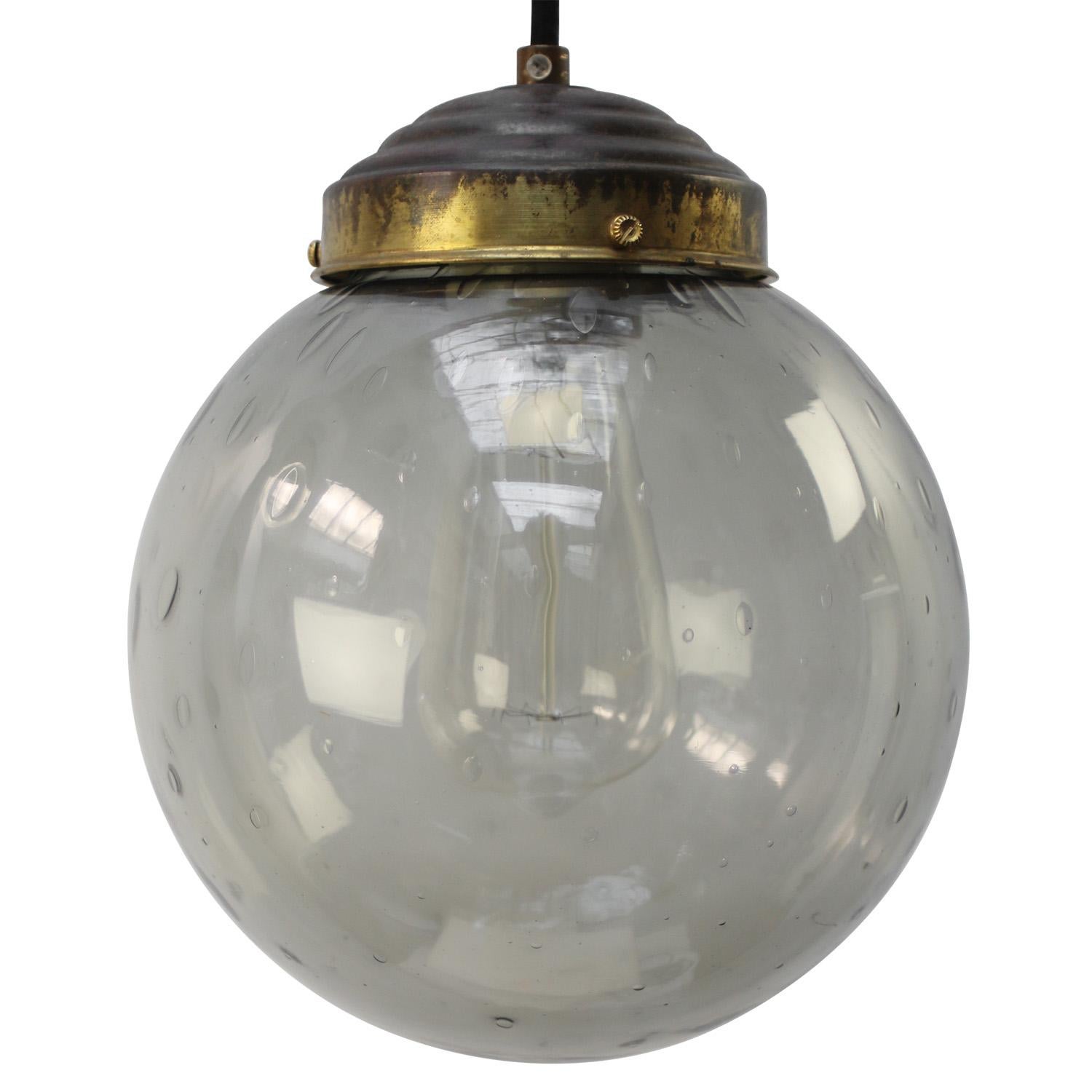 Original vintage smoked air bubble glass pendant.
2 meter Black wire
Brass top

Weight: 2.00 kg / 4.4 lb

Priced per individual item. All lamps have been made suitable by international standards for incandescent light bulbs, energy-efficient
