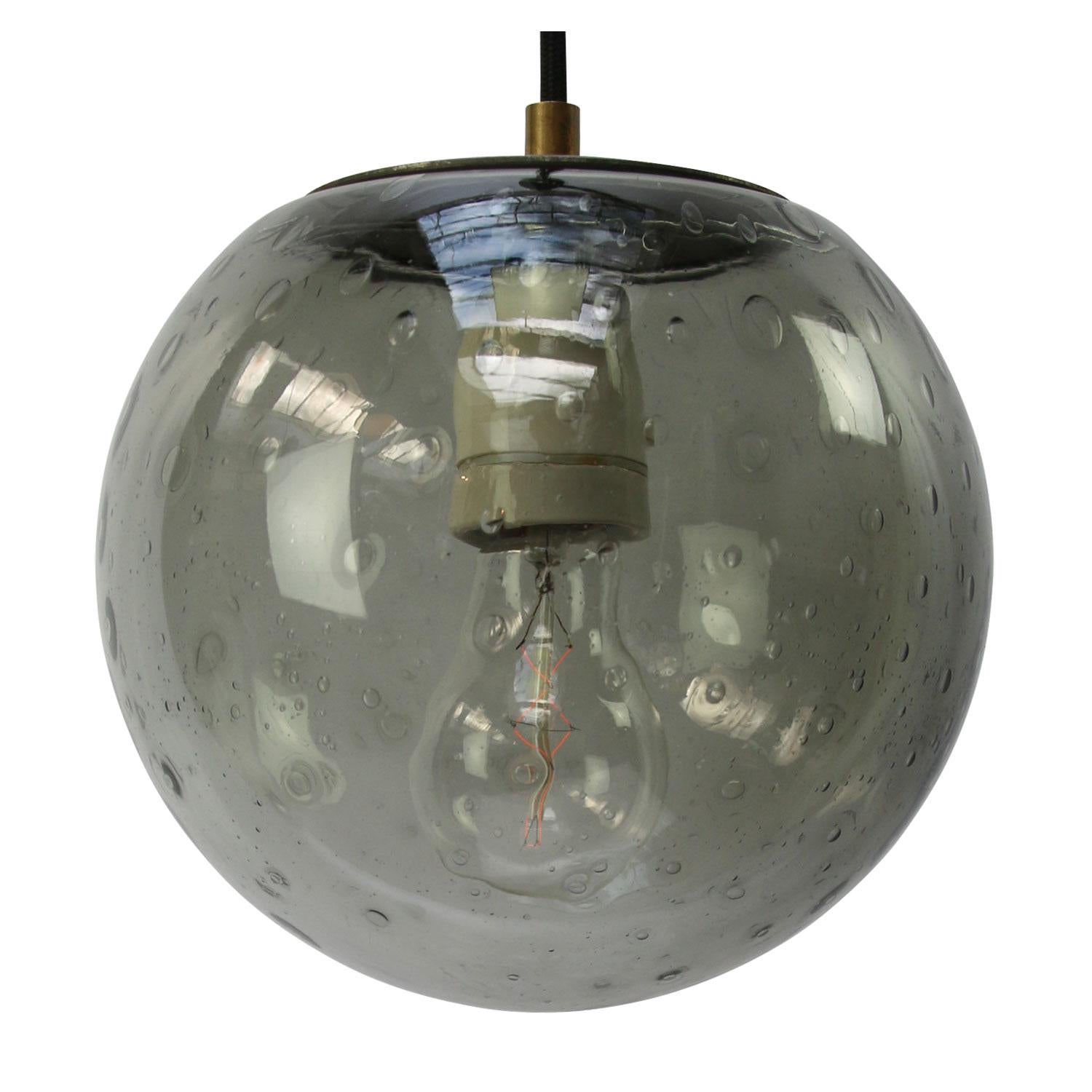 Original vintage smoked air bubble glass pendant.
2 meter black wire
Metal top

Weight: 2.00 kg / 4.4 lb

Priced per individual item. All lamps have been made suitable by international standards for incandescent light bulbs, energy-efficient