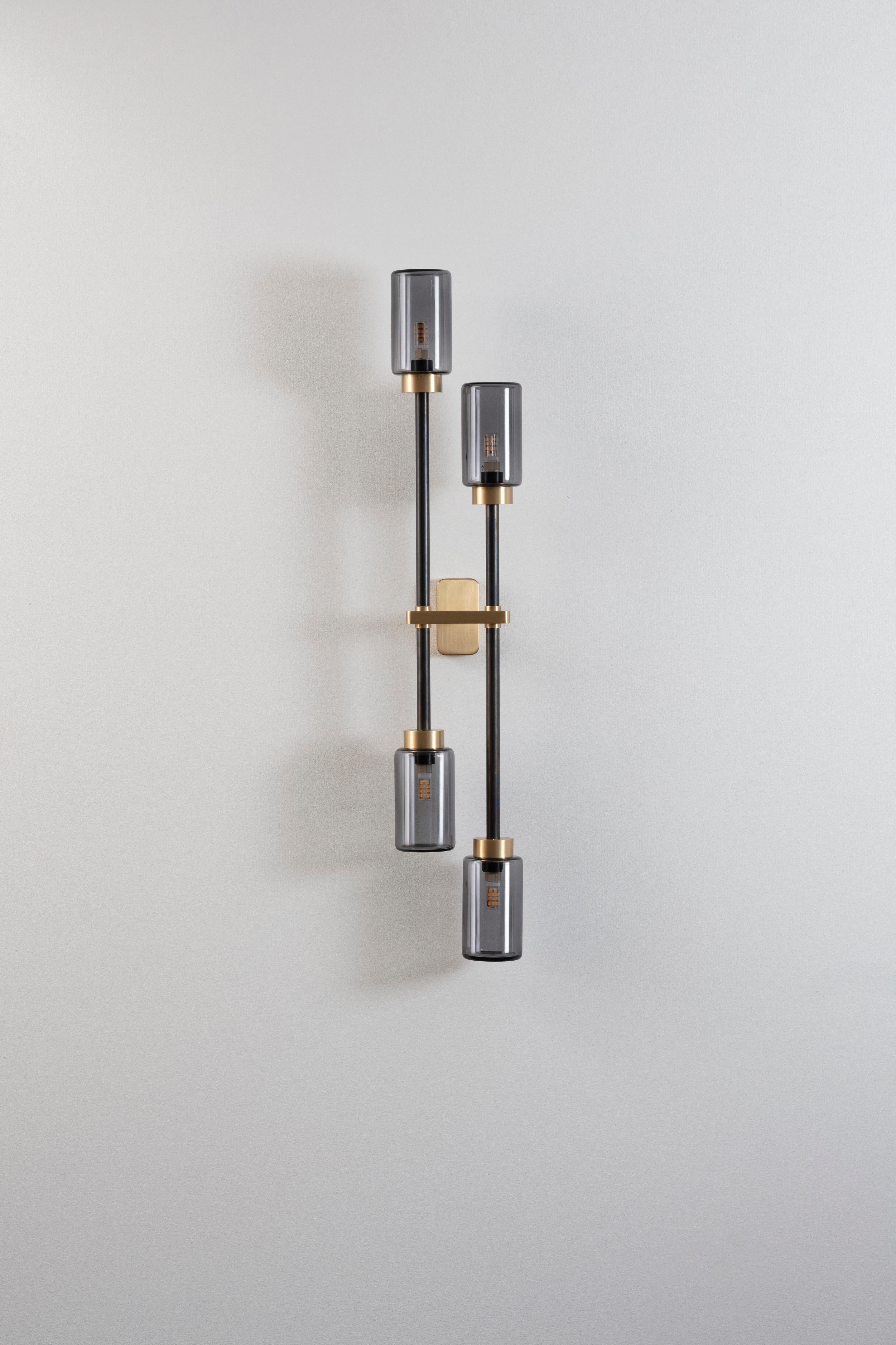 Smoked Farol bouble wall light by Bert Frank
Dimensions: H 79 x W 15 x D 7 cm
Materials: Brass, bronze

Available finishes: Bronzed brass, black brass
All our lamps can be wired according to each country. If sold to the USA it will be wired for