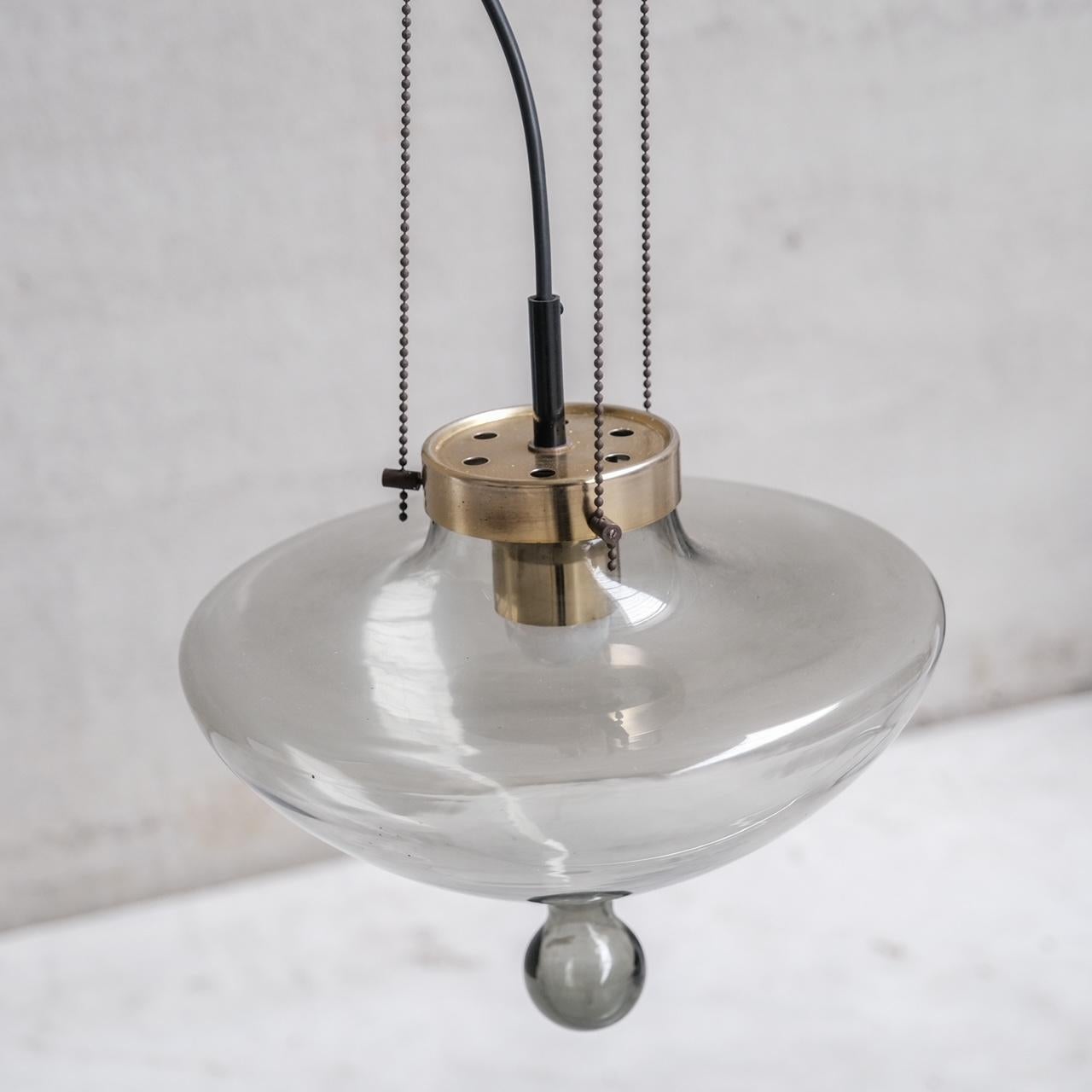 Mid-Century Modern Smoked Glass and Brass RAAK Pendant Light (2 Available) For Sale