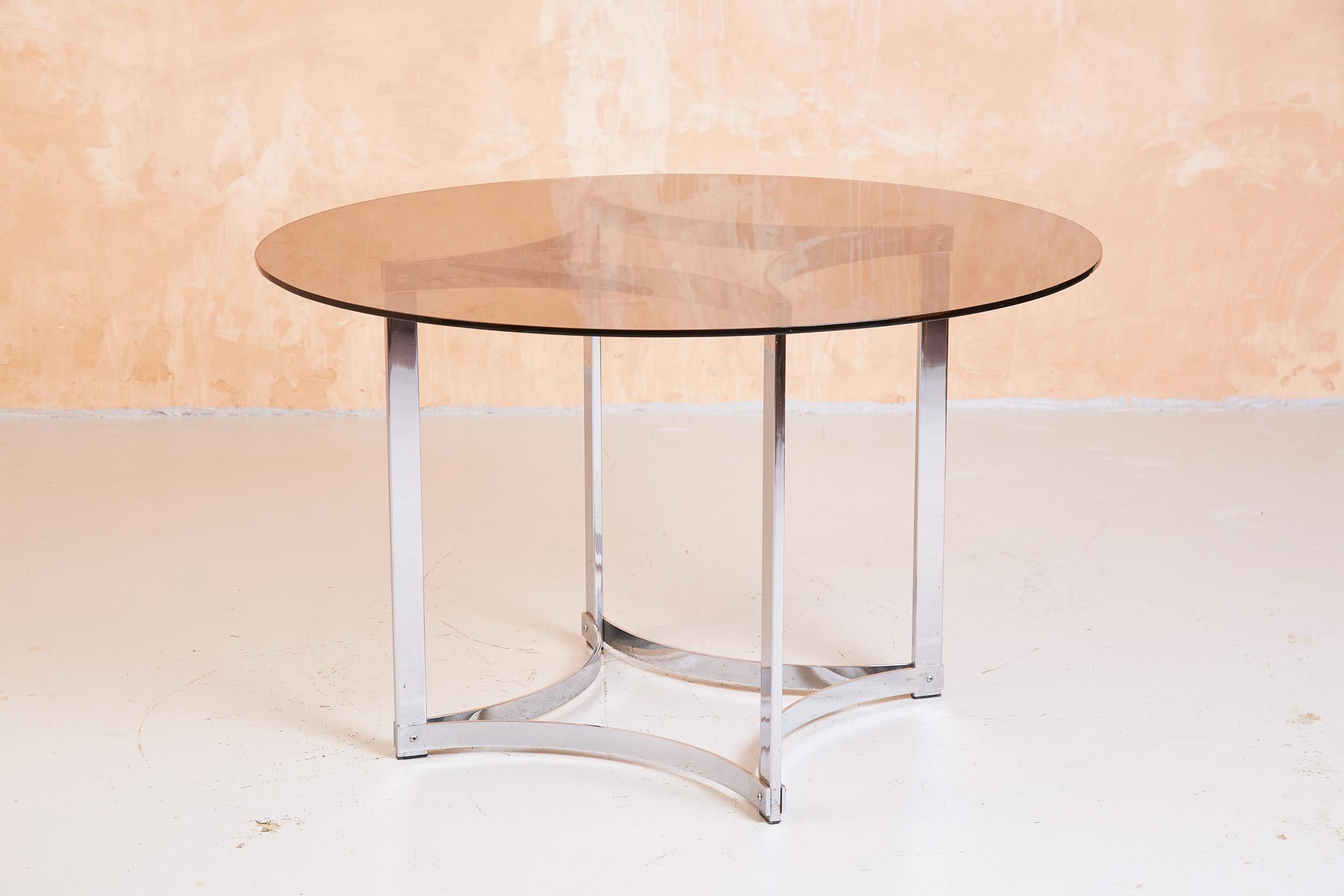 A fine example of a smoked glass and chrome dining table designed by Richard Young for Merrow Associates.

Merrow Associates was a prestige brand originally sold at Harrods and Heals, and now a sought after antique.

We also have another