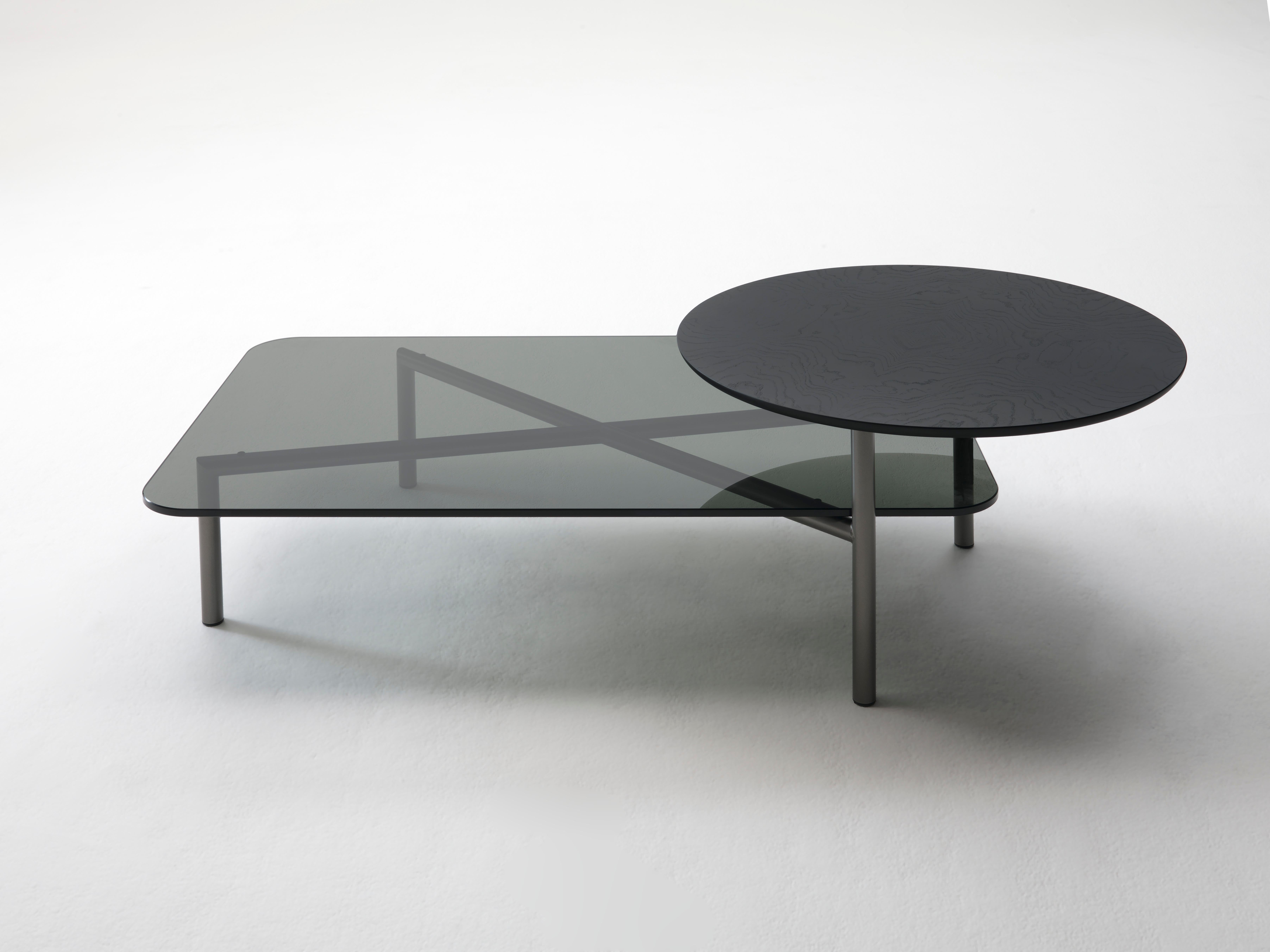 Smoked Glass Bitop coffee table by Rodolfo Dordoni
Materials: Base in bronze lacquered metal. 2 versions of tops: black Marquina marble, white Carrara marble, or gray smoked glass
Technique: Lacquered metal, polished marble. 
Dimensions: 140 x 85