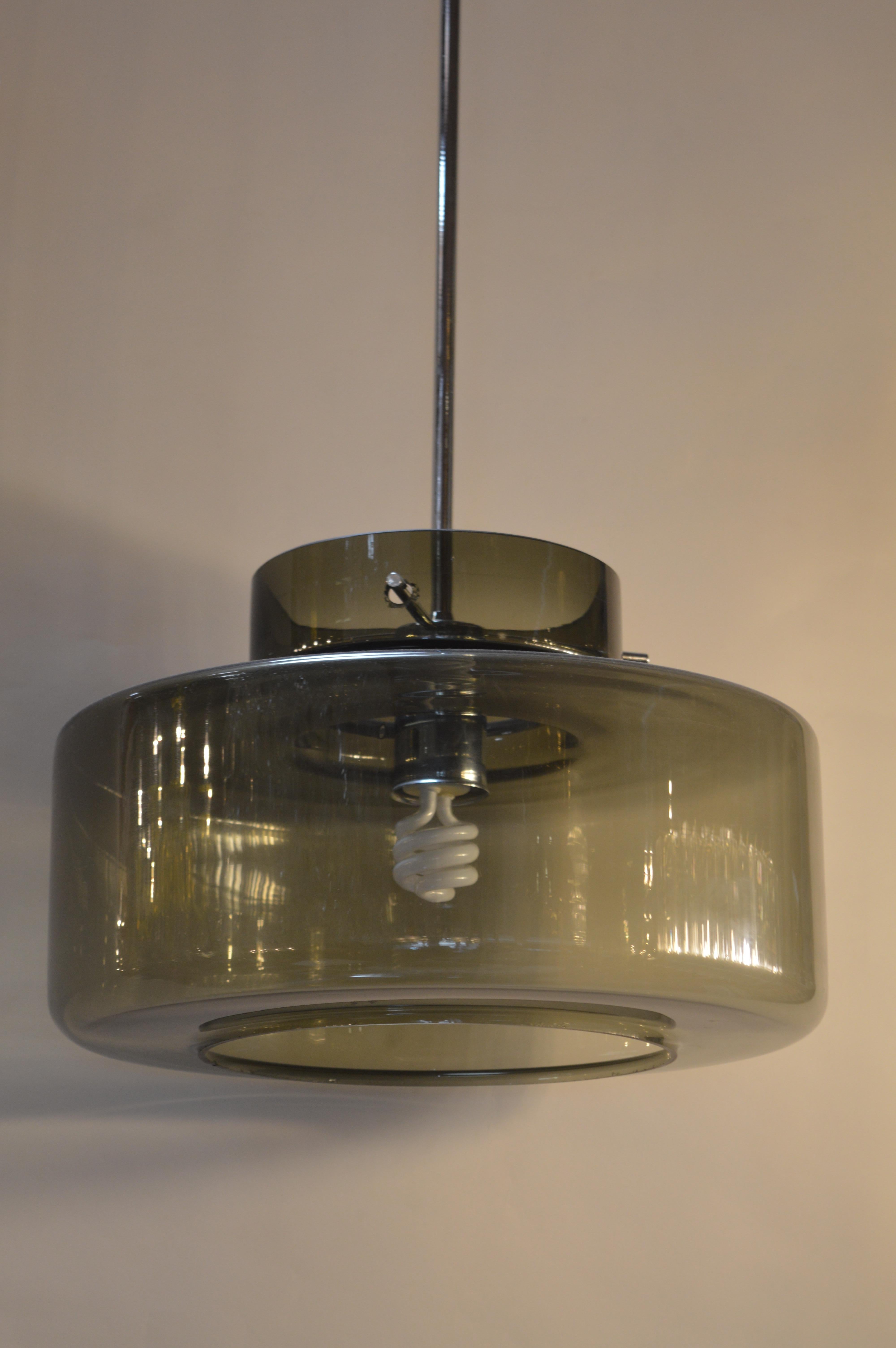 Modern pendant light with grey glass.