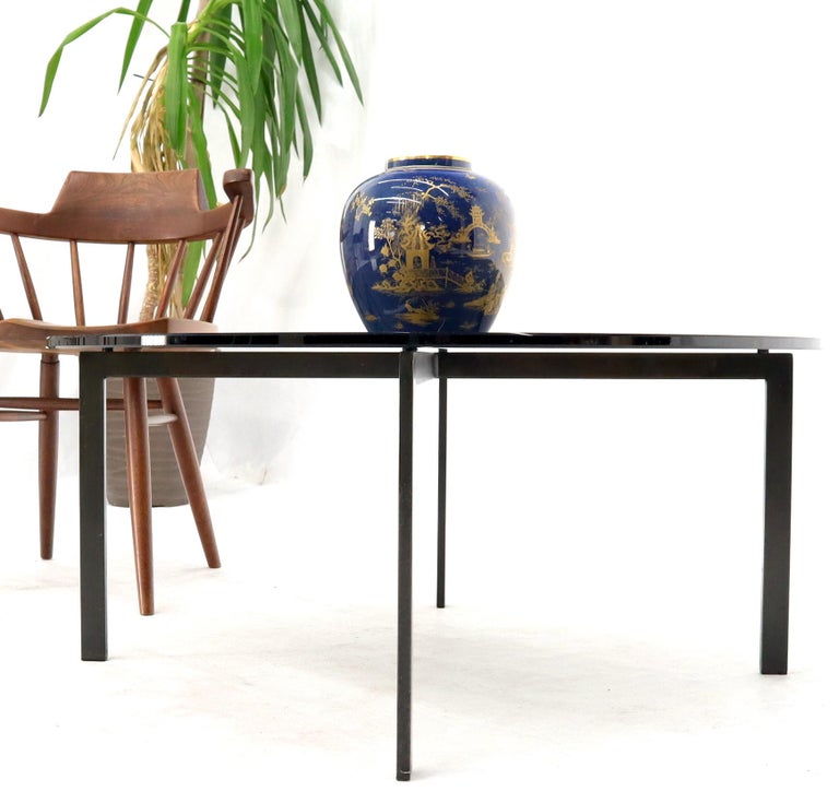 Mid-Century Modern smoked bronze glass round top coffee table. Barcelona style.