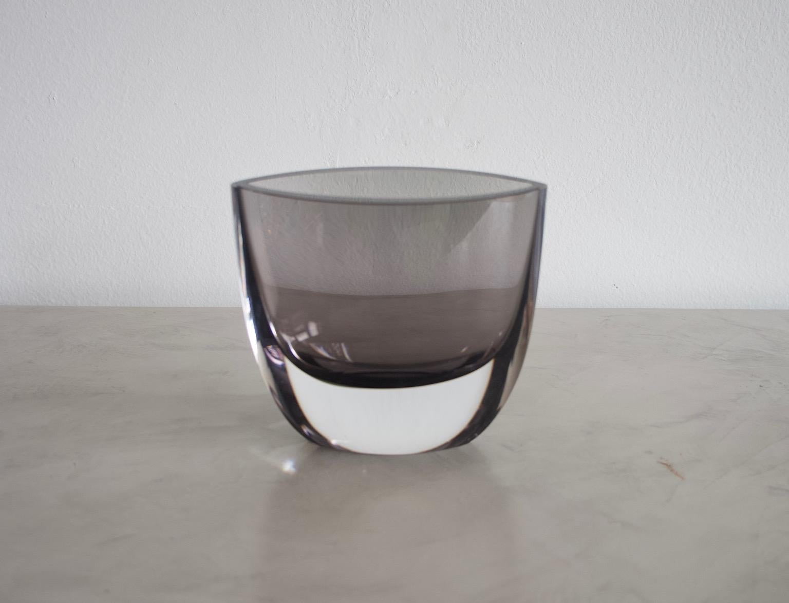 Smoke-colored glass vase with colorless overlap and almond-shaped cross-section designed by Christian von Sydow. Manufactured by Kosta Boda, Sweden. 
Engraved on the bottom: Kosta Boda H8873 C. v. Sydow.