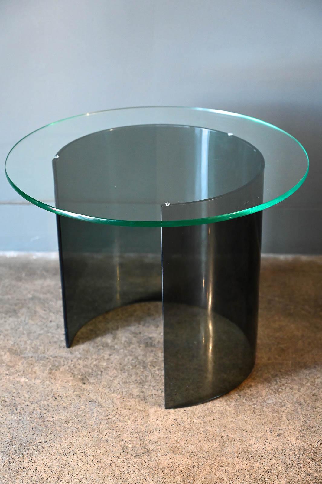 Smoked lucite and glass half moon side table, ca. 1975. In the style of Leon Rosen for Pace, this is unmarked but in excellent original condition with original glass. No chips or cracks in the lucite. Glass top floats on base for easy