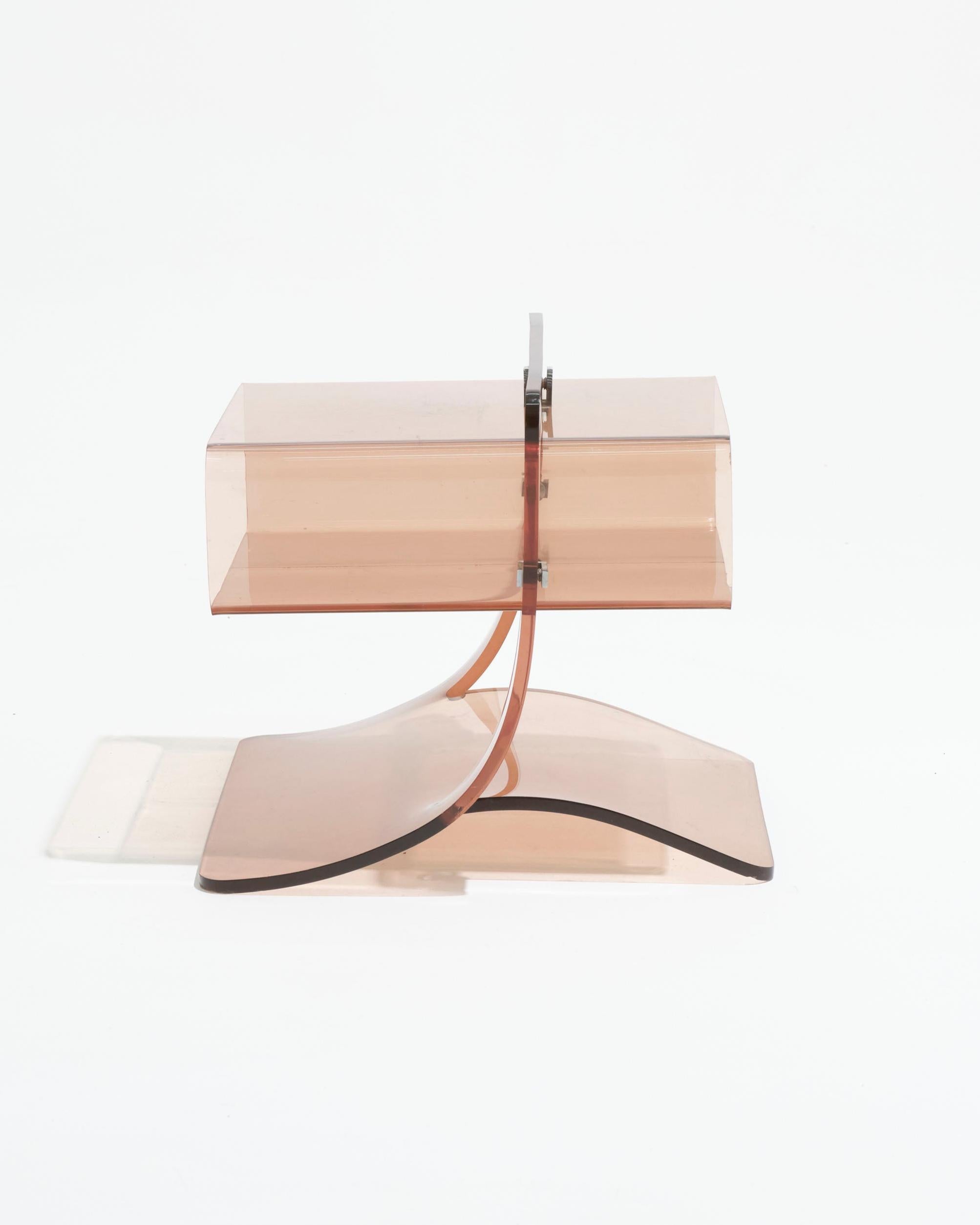 Smoked plexiglass bedside table made by Michel Dumas and produced in 1974 by Roche Bobois. Classic 1970s design. Scratches and signs of use are visible on the surface, typical for the age of the piece.

LP5597