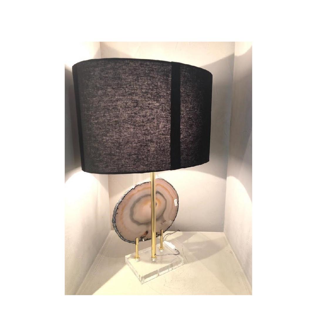 Gorgeous table lamp created with smoked quartz druze selected. The elegant base is made in rectangular acrylic, polished and varnished lace holder. 

The process of creation goes through several craftsmen before reaching the final stage, and each