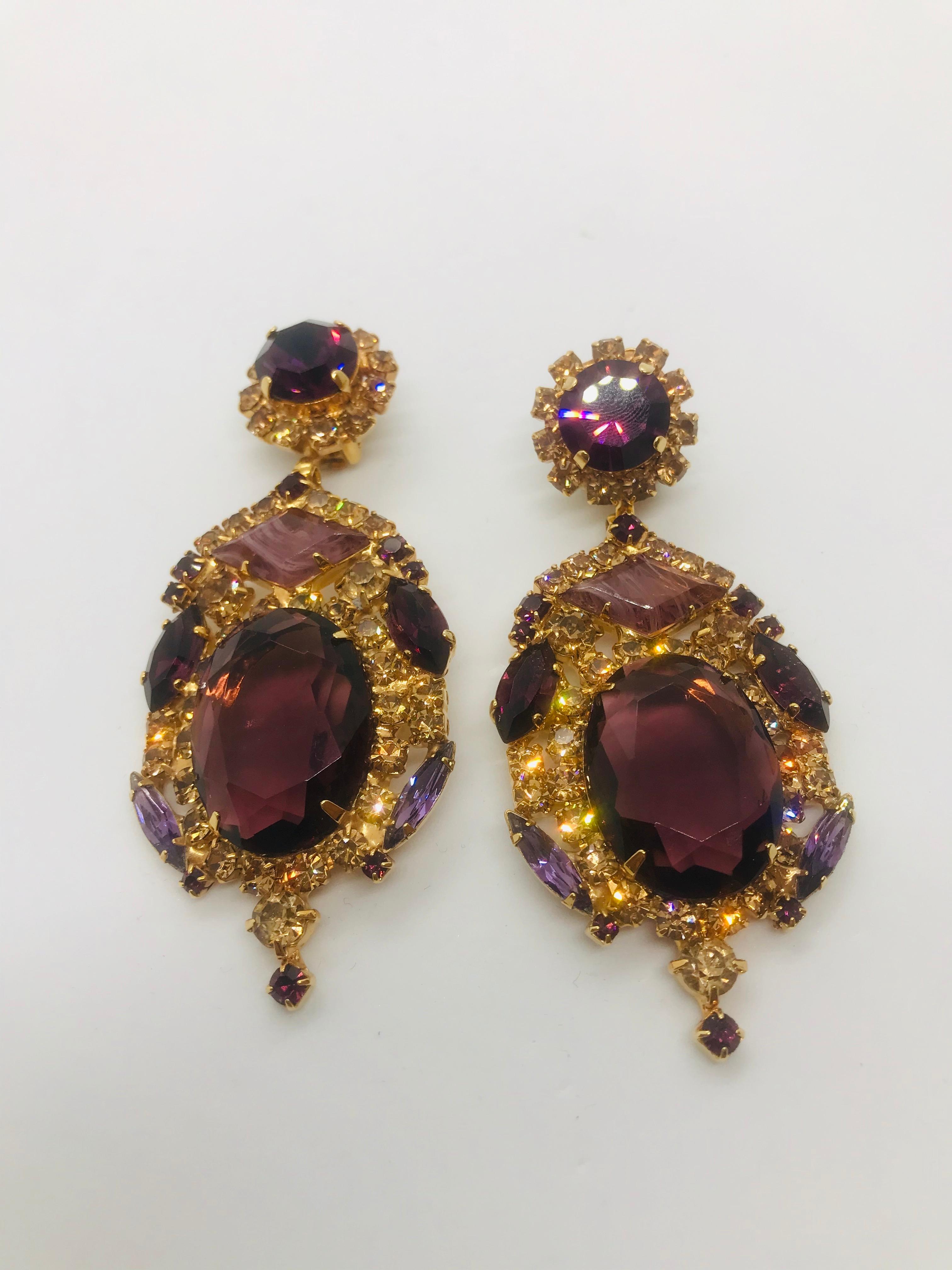 These large and dramatic smoked topaz and amethyst Austrian crystal pendant drop earrings have a 