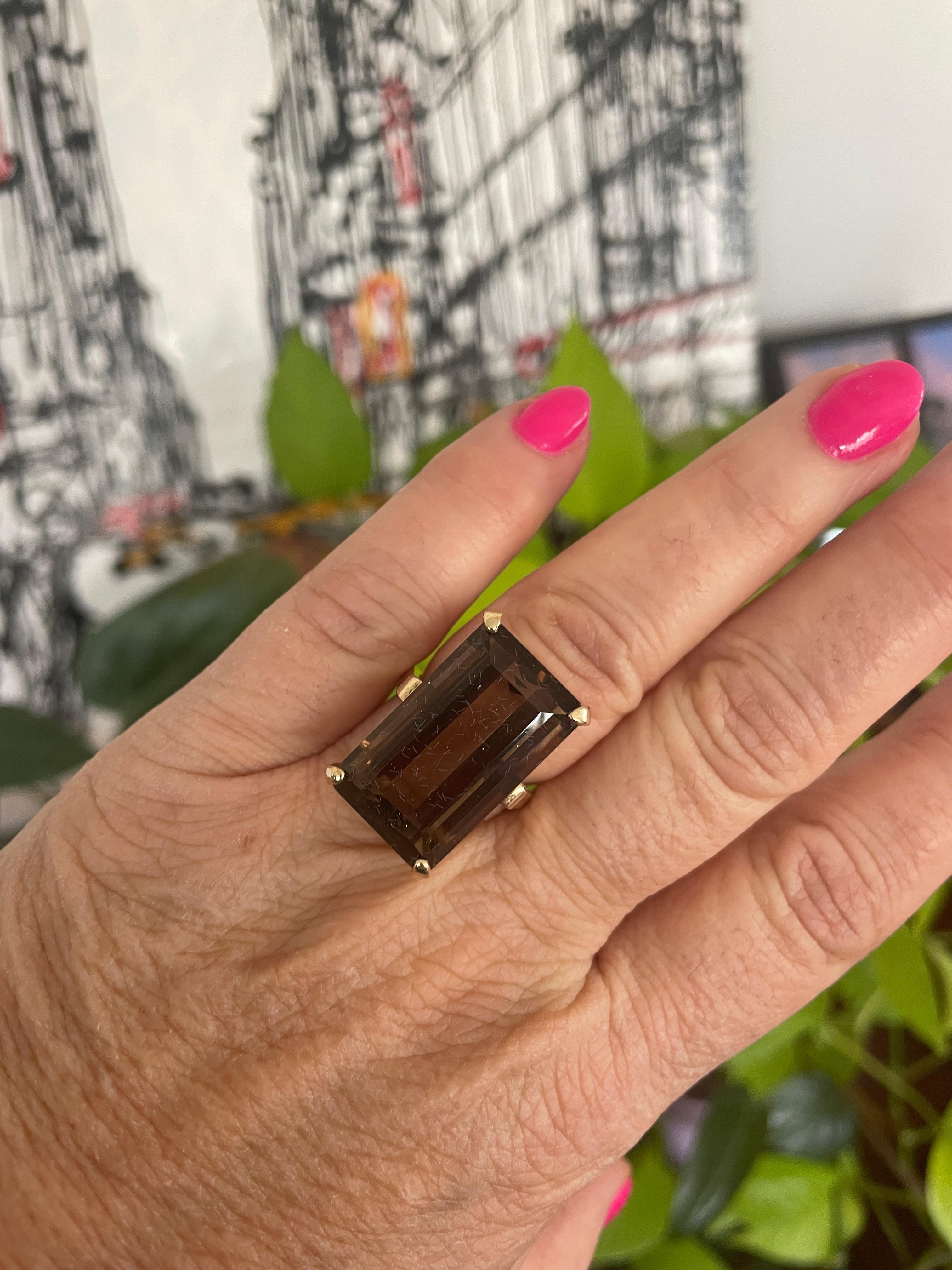 Massive Emerald cut Smokey Quartz ring set in 14K gold This is elegant and sophisticated. Ring is a size 8 and can be sized up or down by us or by your jeweler. This is out of a massive collection of Hopi, Zuni, Navajo, Southwestern, sterling