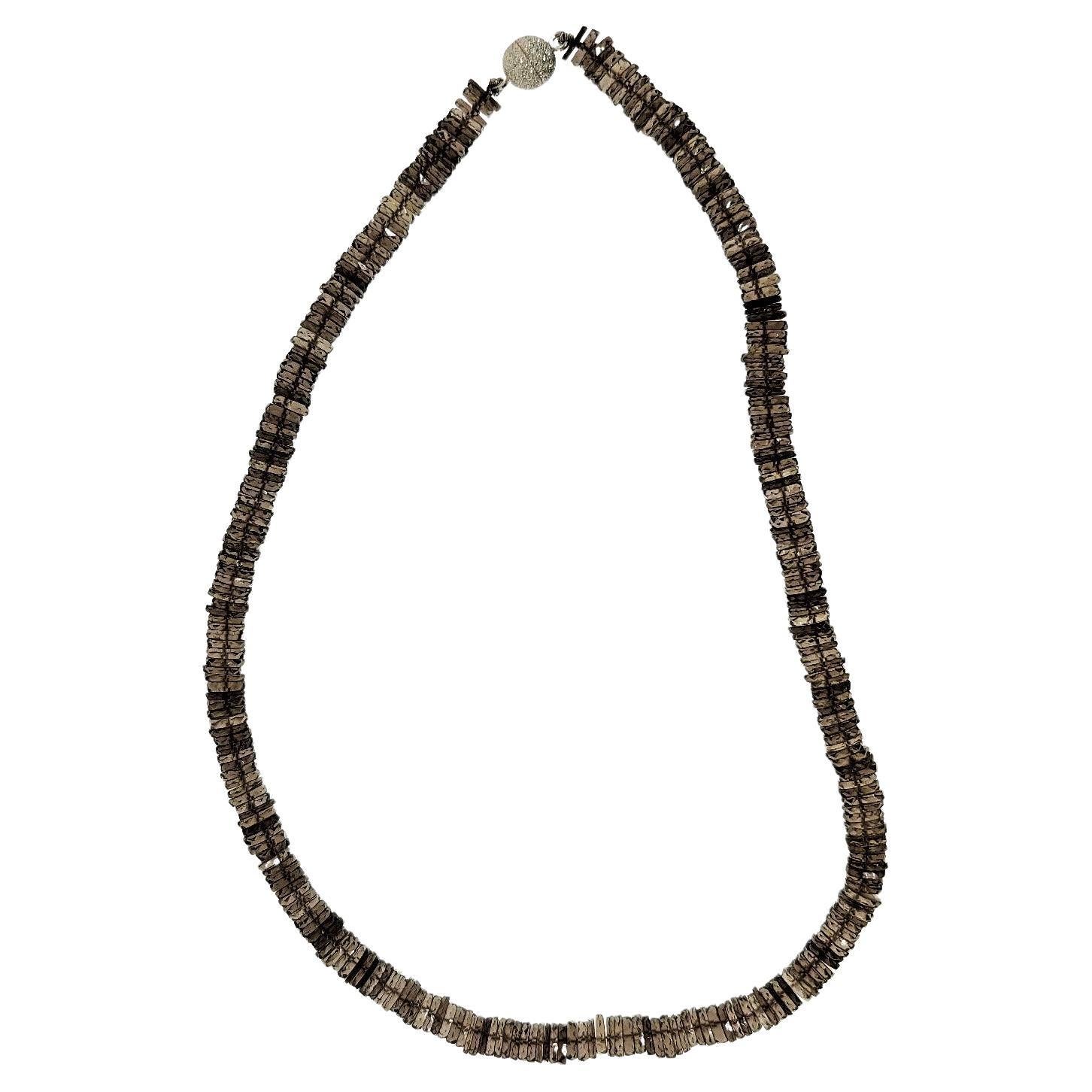 The faceted Smokey Quartz rondels in this necklace vary slightly in color and bring life into this stone.  Measuring 6.5-7mm in circumference and faceted on the end of the rondels, the beads are connected with a silver magnetic clasp.  The necklace