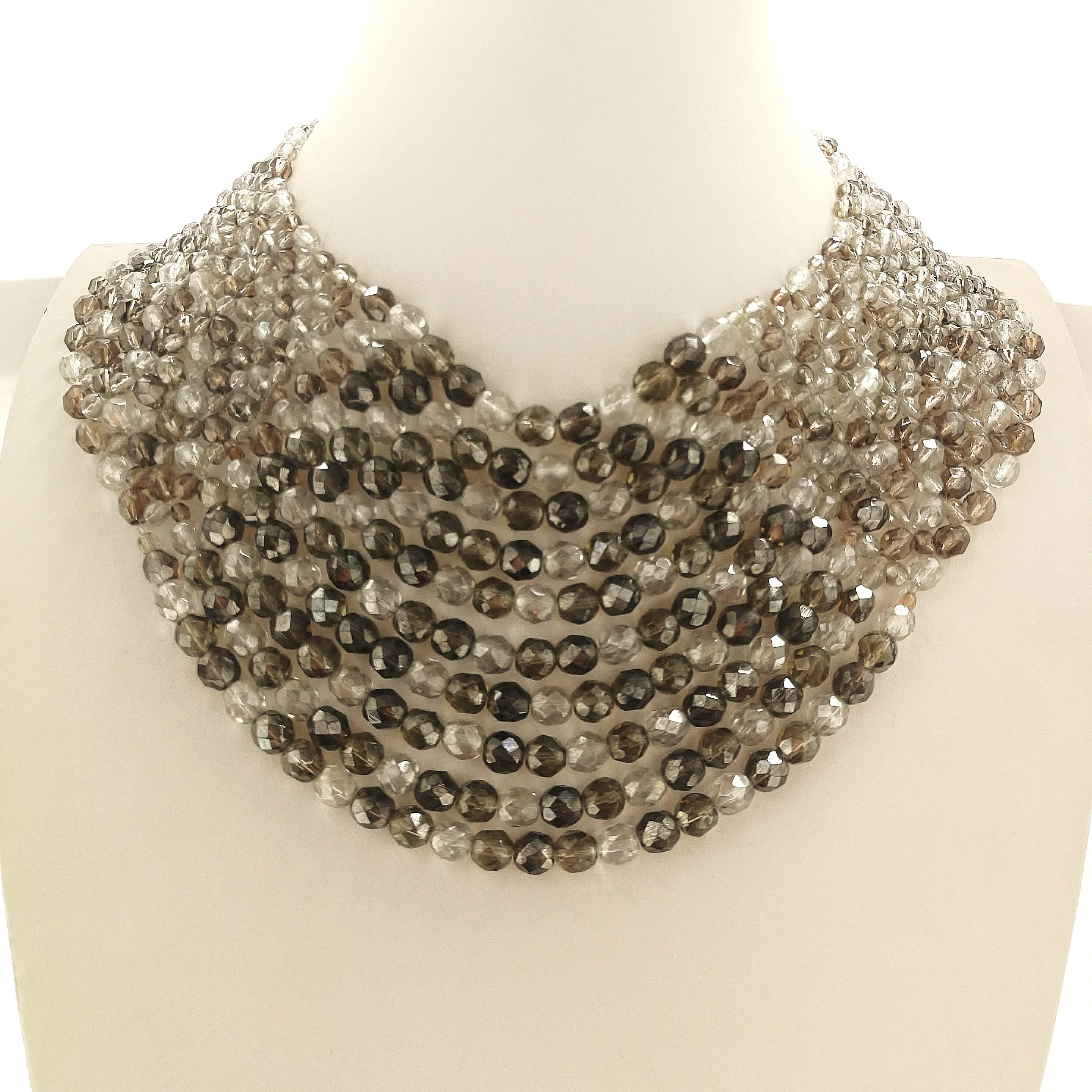 A beautiful, softly hued necklace, consisting of ten rows of smokey quartz, taupe and clear half crystal faceted beads , in varying sizes, from Coppola e Toppo, from 1962 -64. Ten string-mounted rows are attached to weft - mounting or 'weaving', 