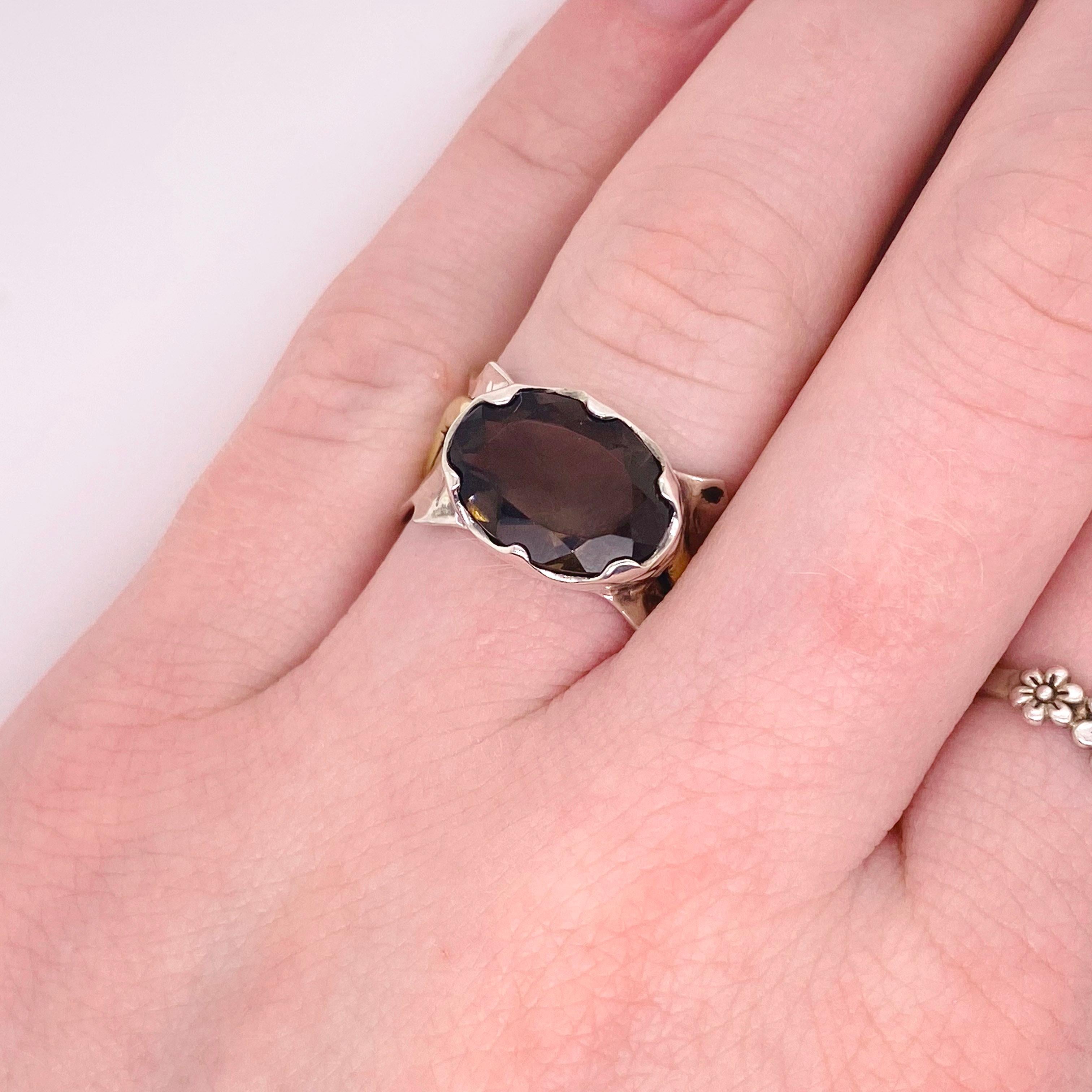 Do you want something unique but very affordable! This genuine smokey topaz is 4 carats and set with a scalloped edge. The ring has a gold accent to make it a mixed metal look. This ring is a size 7 but can be adjusted from size 5 to 9. The details