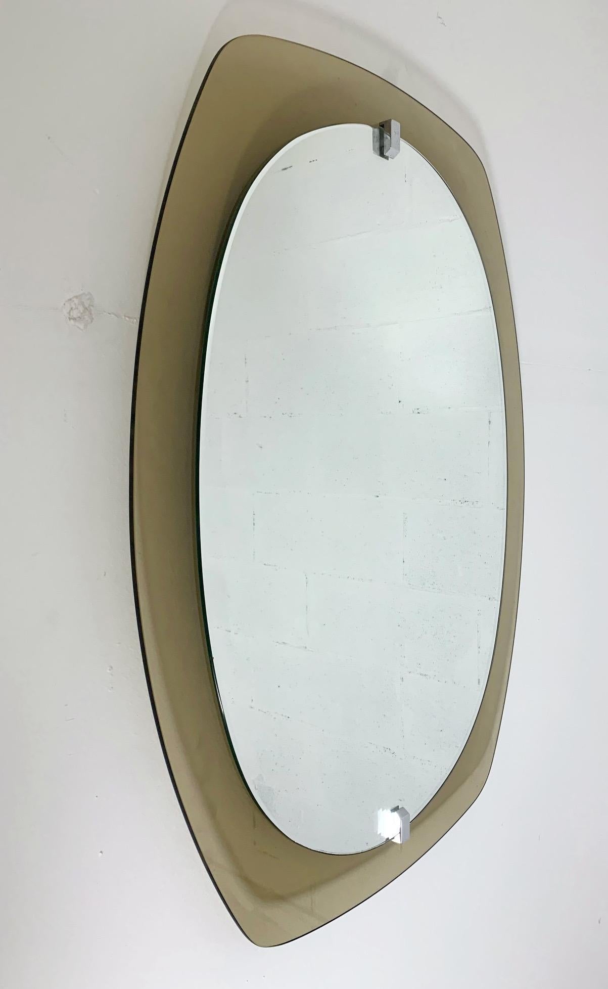 Vintage Italian oval mirror with smoky brown beveled glass by Veca / Made in Italy, circa 1960s
Original sticker on the back
Measures: Height 31.5 inches, width 23.5 inches, depth 2 inches
1 in stock in Italy ON 50% OFF SALE for $1,249 !!!
Order