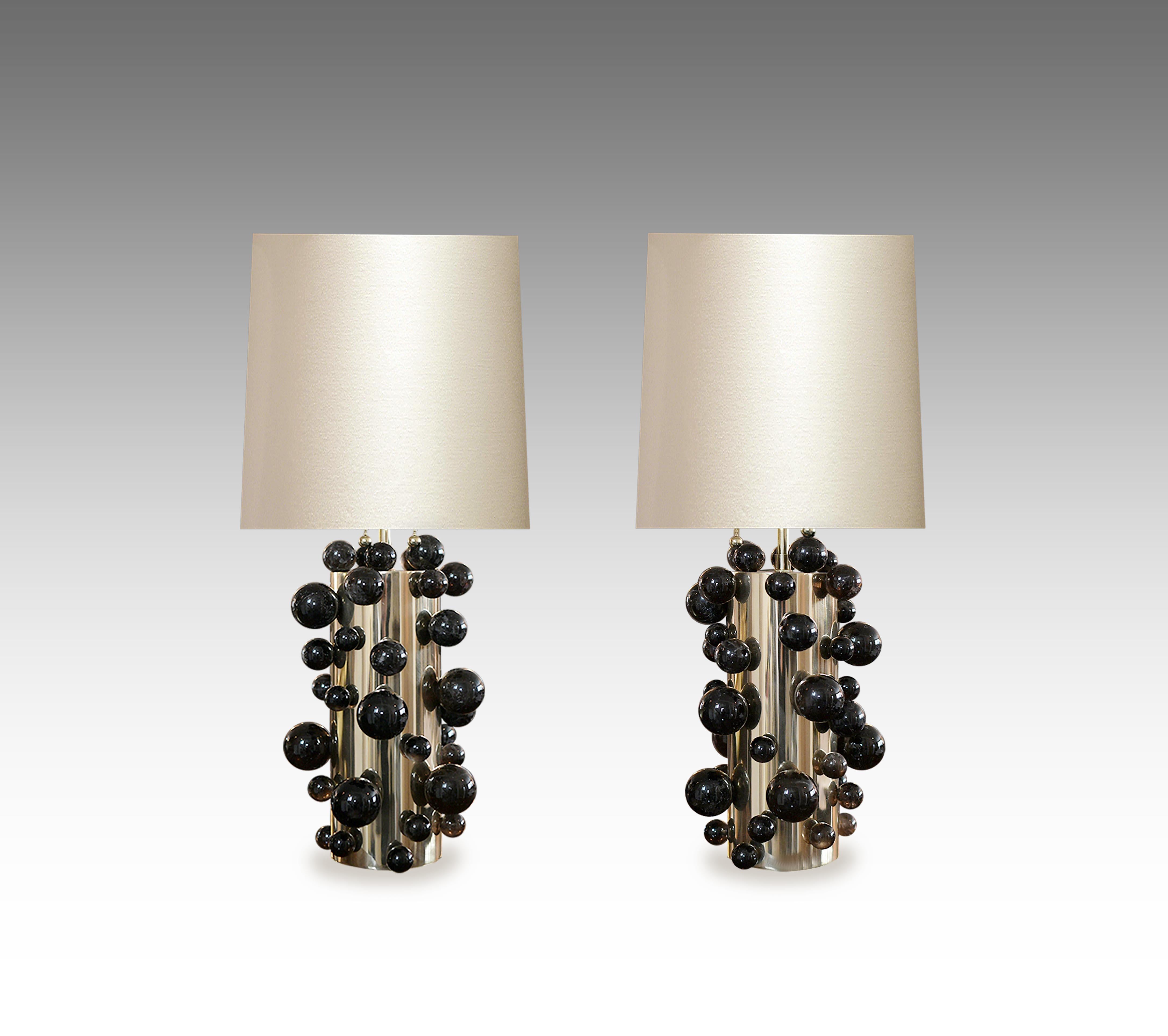 A pair of smoky rock crystal quartz bubble lamps with polished nickel bases. To the top of the rock crystal 13”, Created by Phoenix Gallery, NYC..
Lampshade do not included.