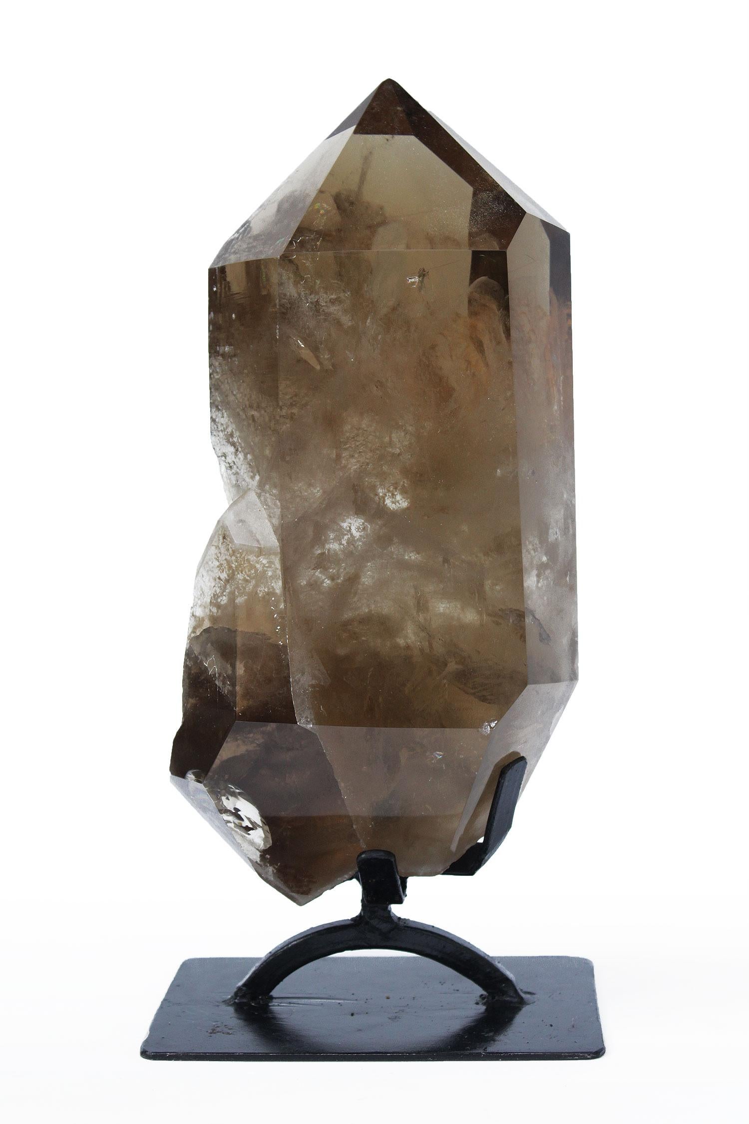 Museum-quality smoky citrine crystal point on a custom black stand. Citrine is a gem that is valued for its yellow to brownish color. It is a  yellow variety of quartz, so its name comes from the old French word for lemon. This is a rare specimen of