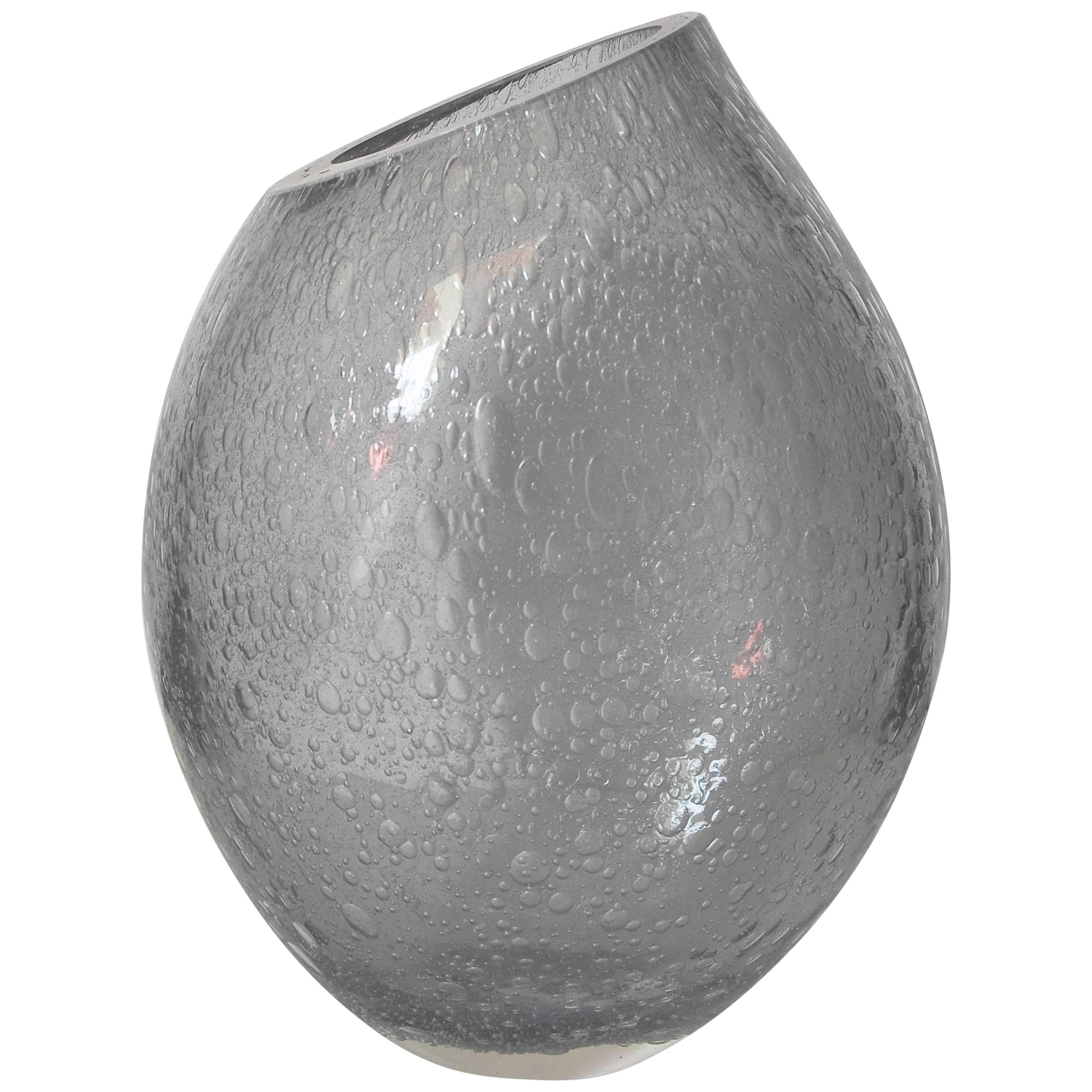 Italian vase or sculpture in thick smoky gray Murano glass blown with bubbles within the glass in Pulegoso technique by Alberto Dona for Fabio Ltd
Signature engraved on the base / Made in Italy
Measures: Height 13.5 inches / width 9.5 inches / depth