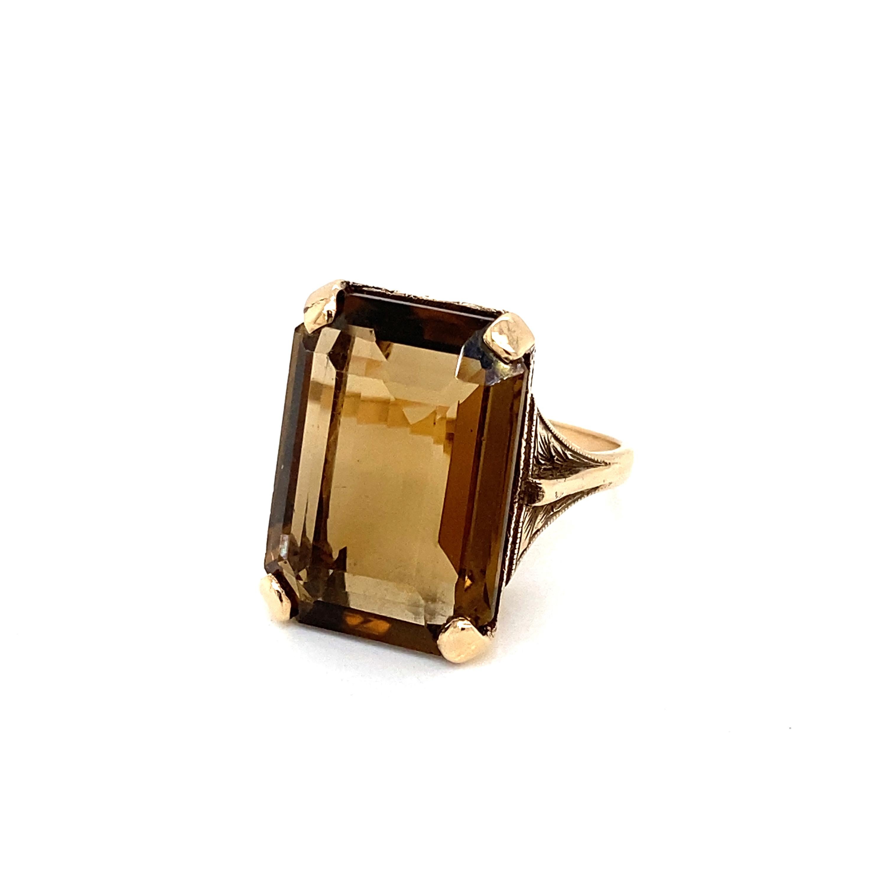 Wear a piece of history on your fingers with this lovely dress ring dating from around the 1960's or 1970's.

The centrepiece of this fantastic ring is an impressive 20 x 14.8mm emerald cut smoky quartz, held in place by a 9 carat gold, sturdy four