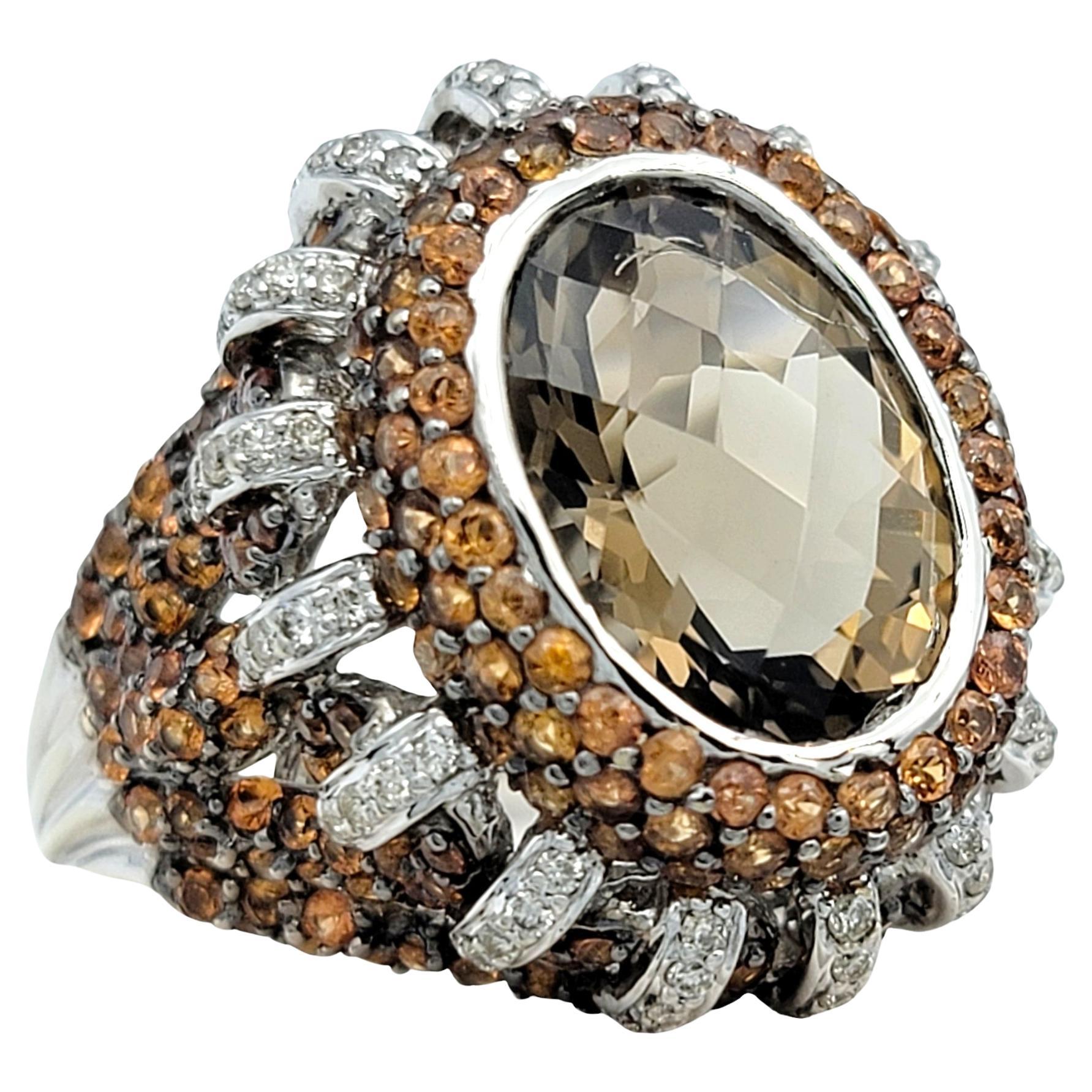 Ring Size: 9

This unique smoky quartz cocktail ring is a true statement of elegance and sophistication. This stunning piece is meticulously crafted in 14 karat gold, blending contemporary design with timeless luxury. This captivating smoky quartz