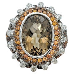 Anillo de cóctel con pavé de cuarzo ahumado, diamante y zafiro naranja en oro de 14 quilates