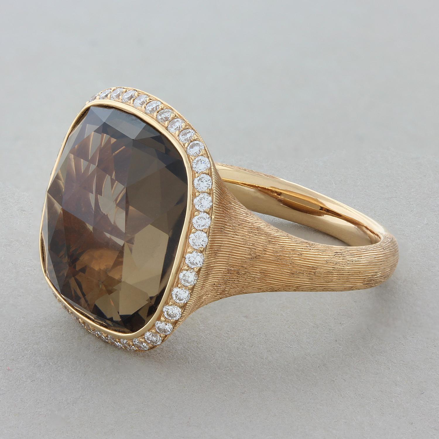 An everyday ring featuring a 10.72 carat cushion cut checkerboard smoky quartz gemstone. It is haloed by 0.38 carats of round brilliant cut diamonds set in 18K rose gold with a brushed finish.

Ring Size 6.25 (Sizable)

