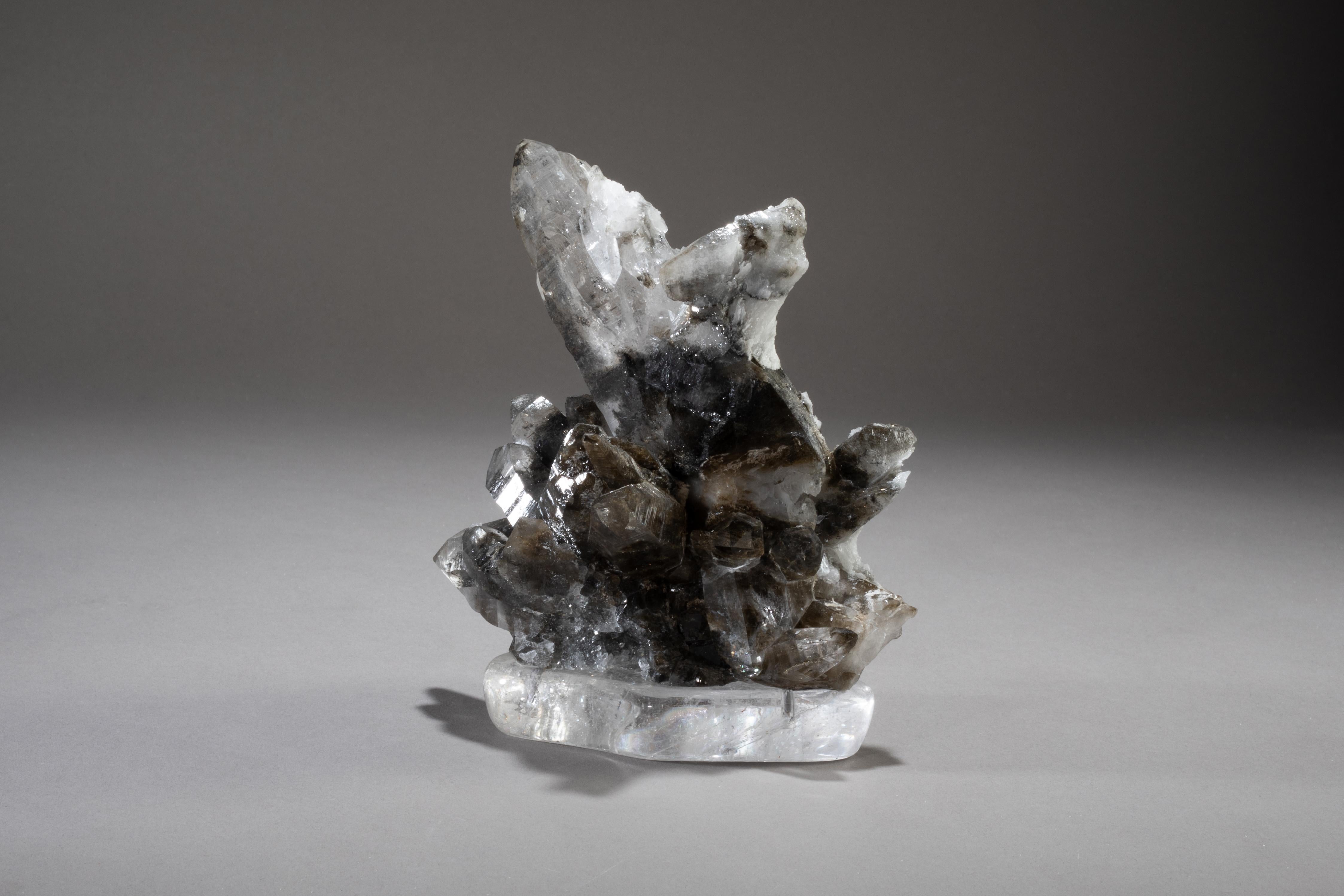 Smoky quartz on crystal base.