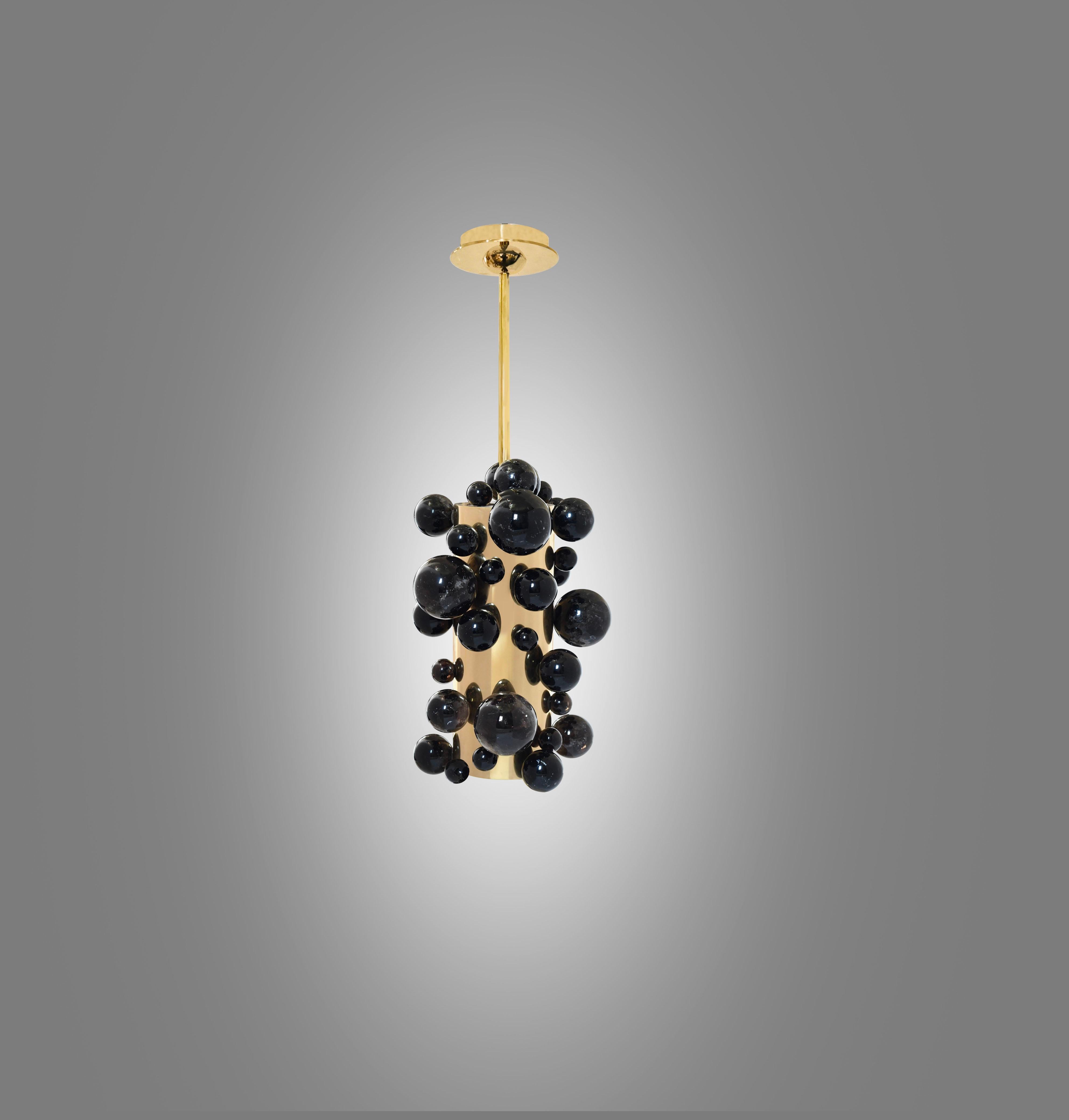 Smoky rock crystal bubble pendant light with polished brass finish. Created by Phoenix Gallery, NYC.
Two sockets installed. Use LED warm light bulbs. 50w each. 100 w total.
Dimension of the pendant: 8